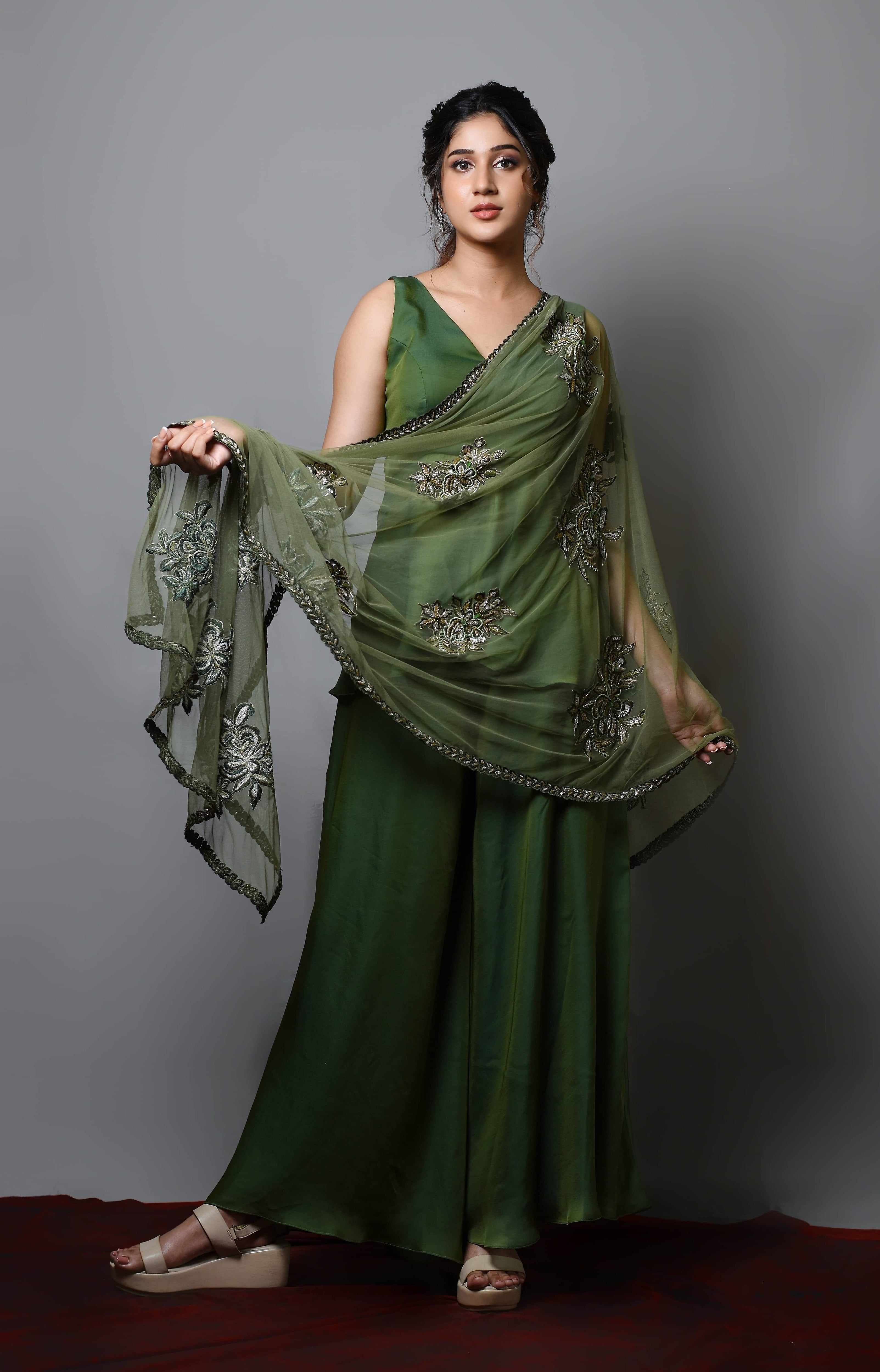 Actress Rabiya Khatoon in a green satin georgette peplum sharara palazzo set with embellished dupatta. dupatta detailing.