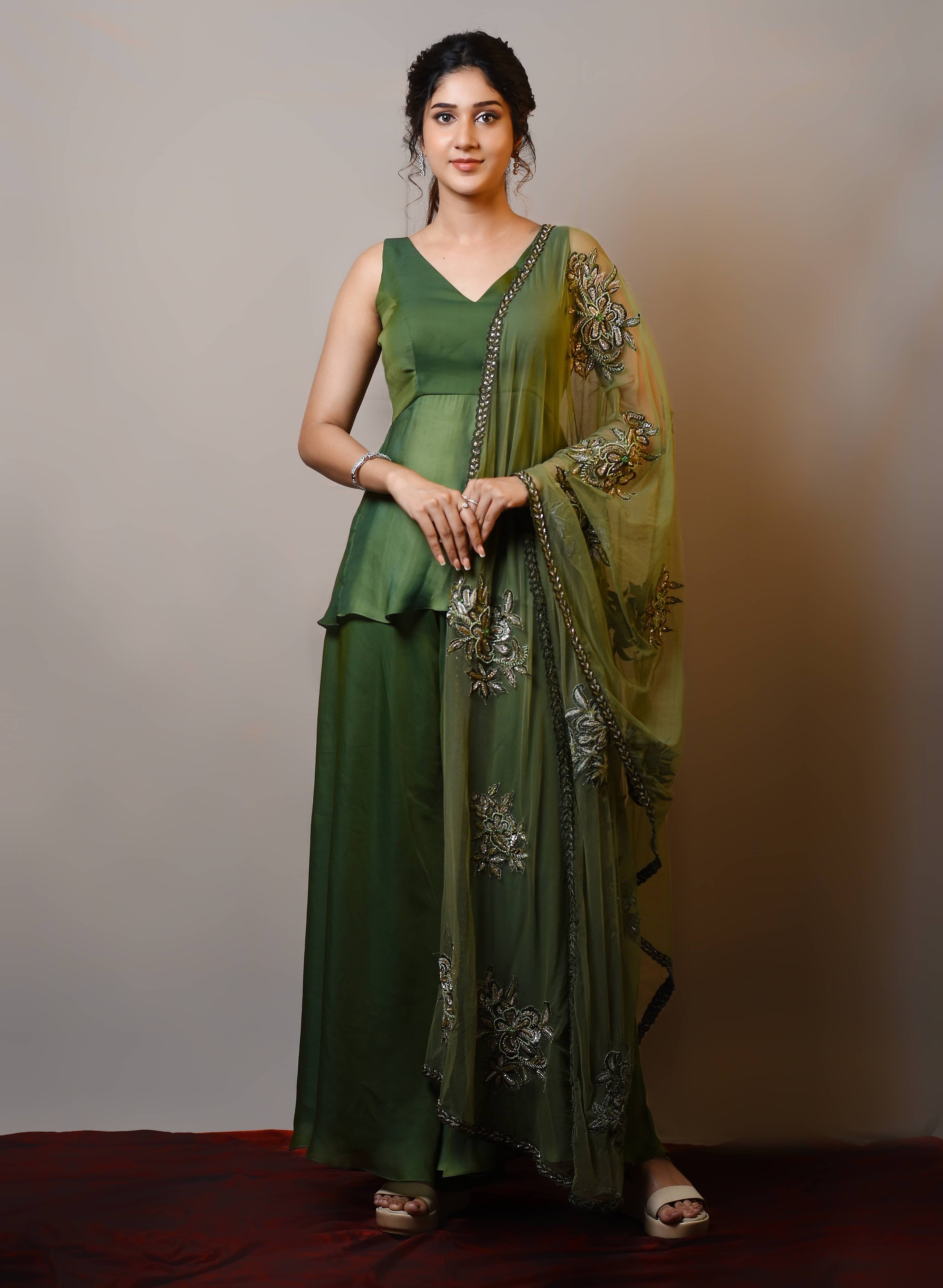 Actress Rabiya Khatoon in a green satin georgette peplum sharara palazzo set with embellished dupatta