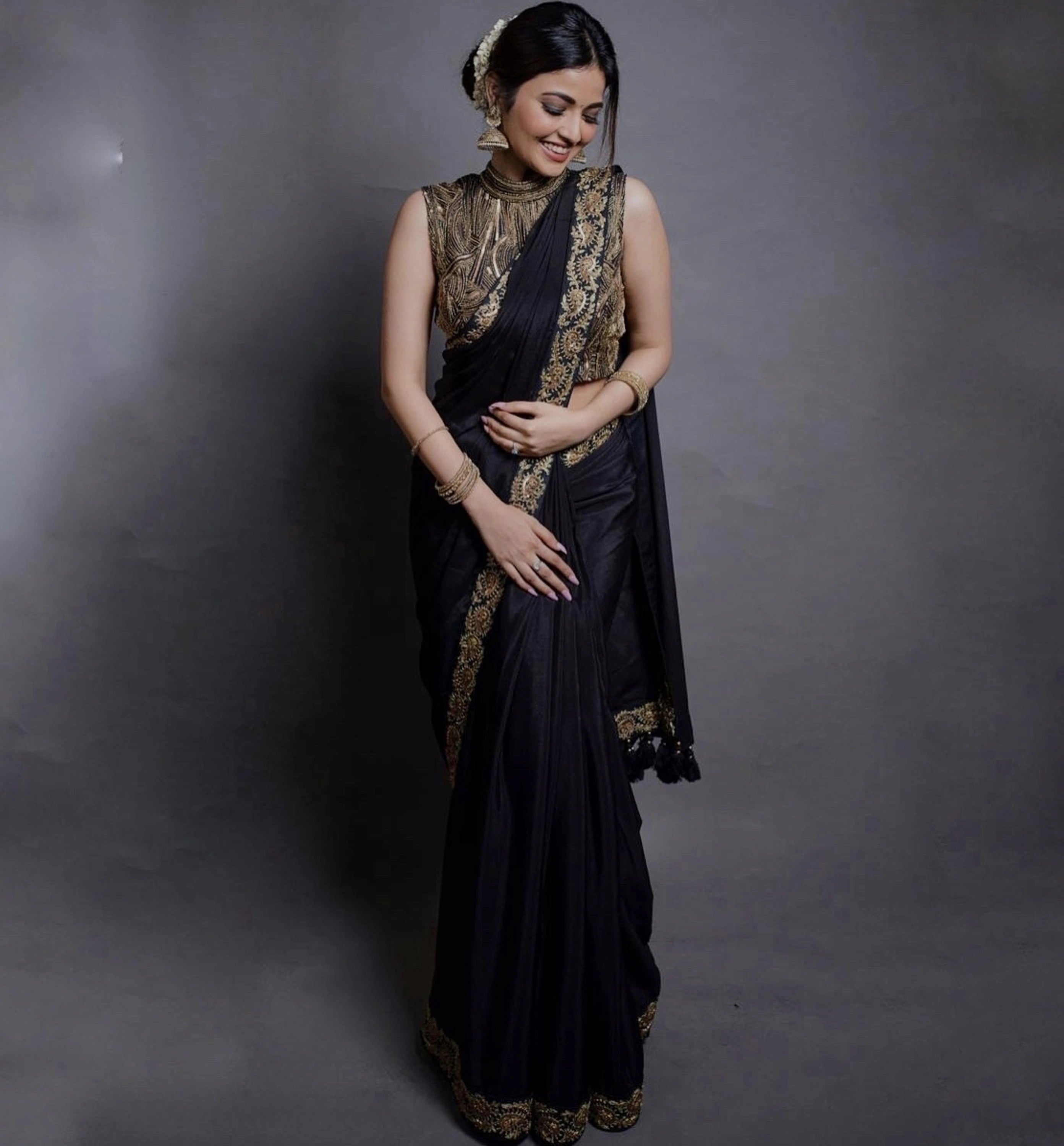 Actress Shirin Kanchwala in a crepe silk black saree intricately handcrafted with zardozi, sequins and dori work by team Archana Karthick.