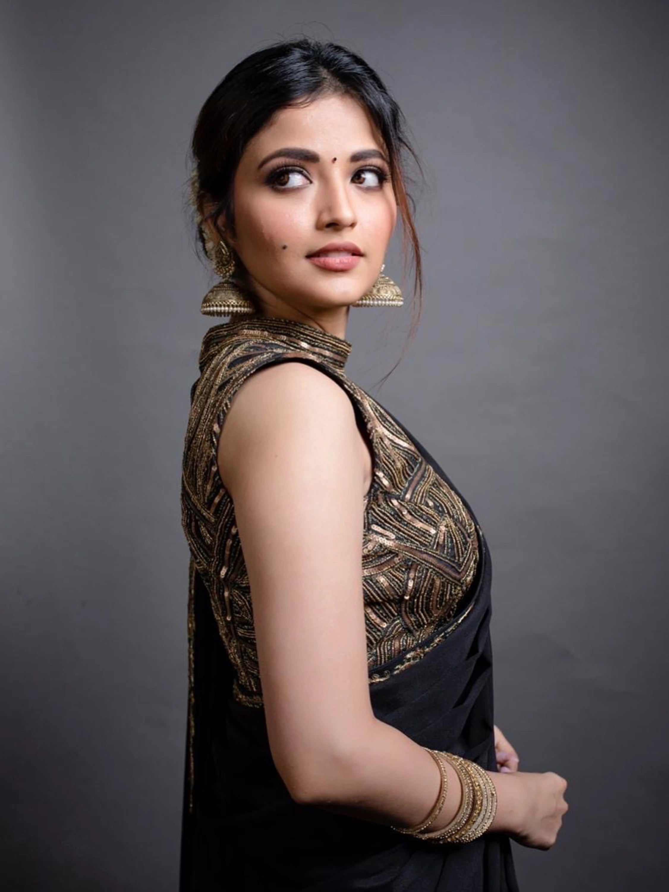 Actress Shirin Kanchwala looks right in a crepe silk black saree intricately handcrafted with zardozi, sequins and dori work by team Archana Karthick.