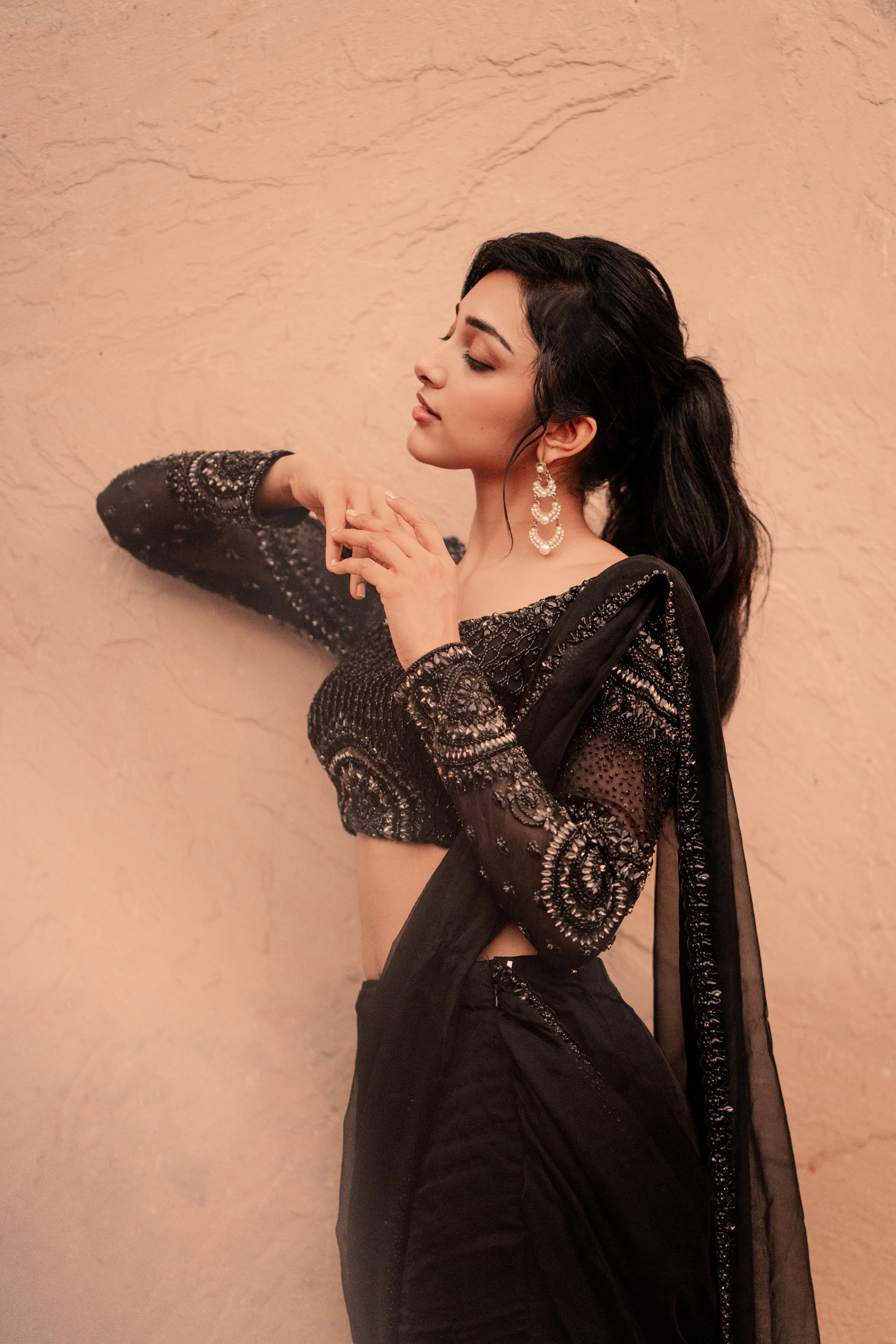 Actress & dancer Preity Mukhundhan posing in "The Black Mermaid" black mermaid lehenga saree from Archana Karthick's collection.