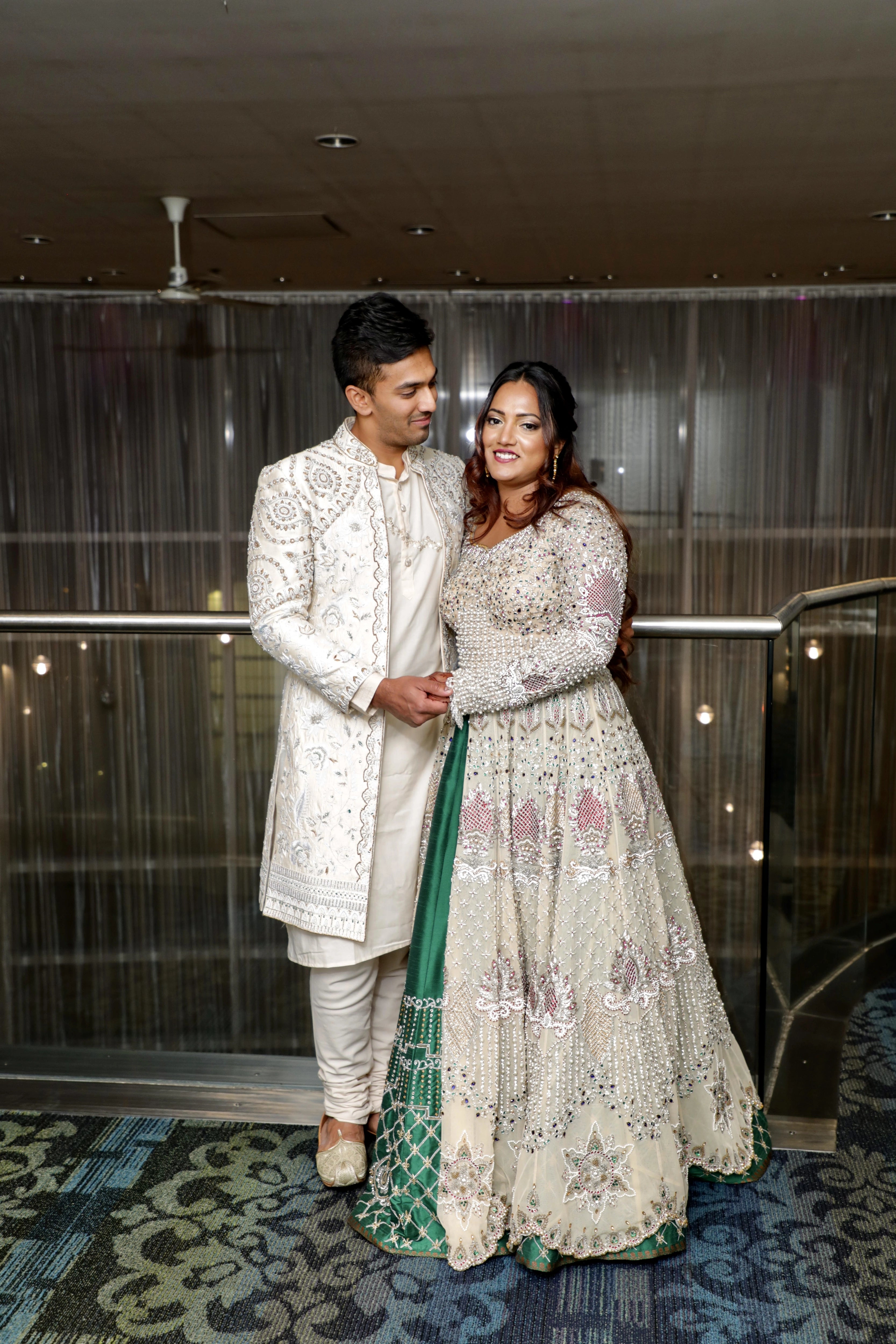 Angeline & Groom from Canada in an ivory masakali lehenga and sherwani handcrafted by team Archana Karthick