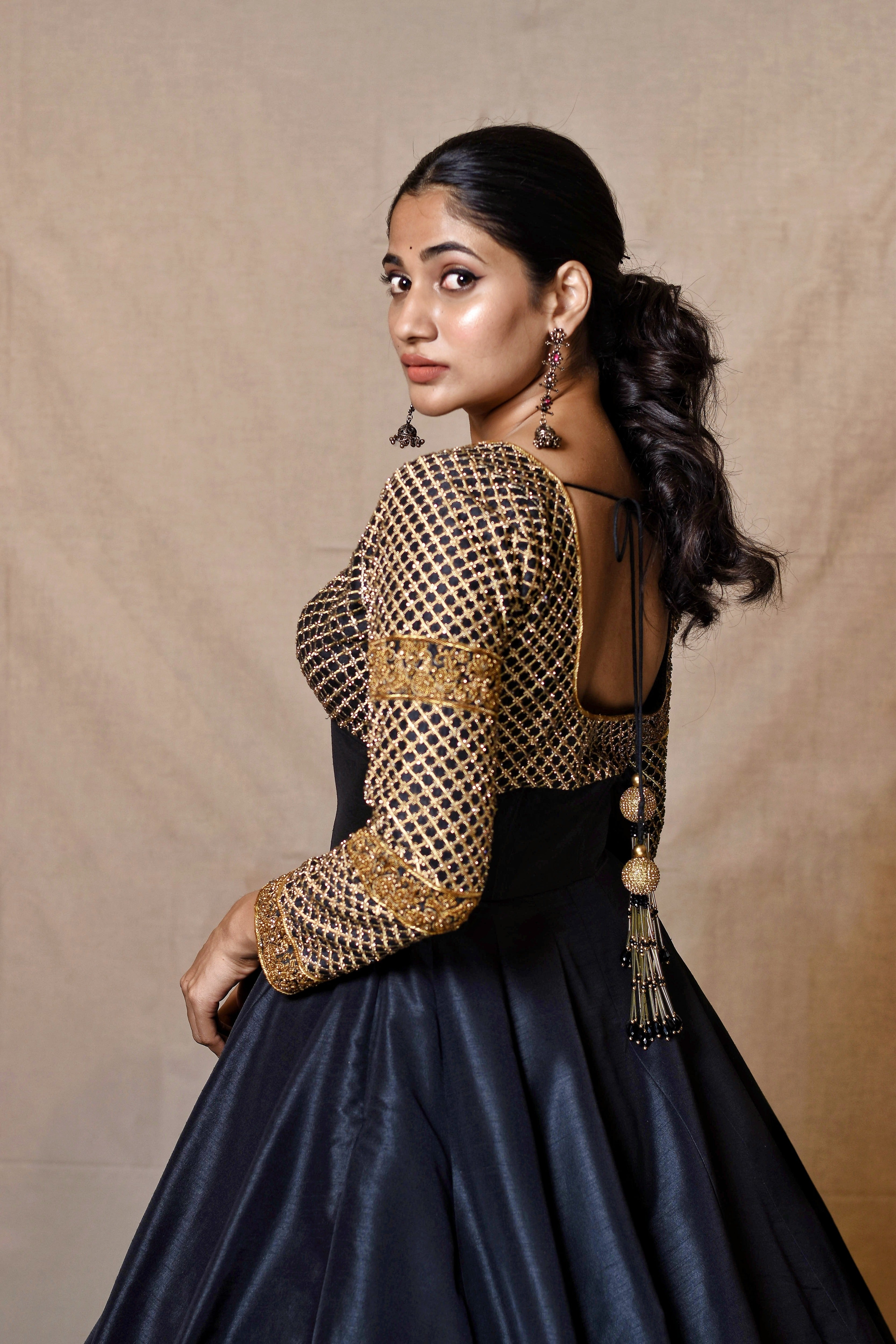 Bigg Boss fame and Actress Losliya Mariyanesan in Black Designer Anarkali by Archana Karthick looking back at camera