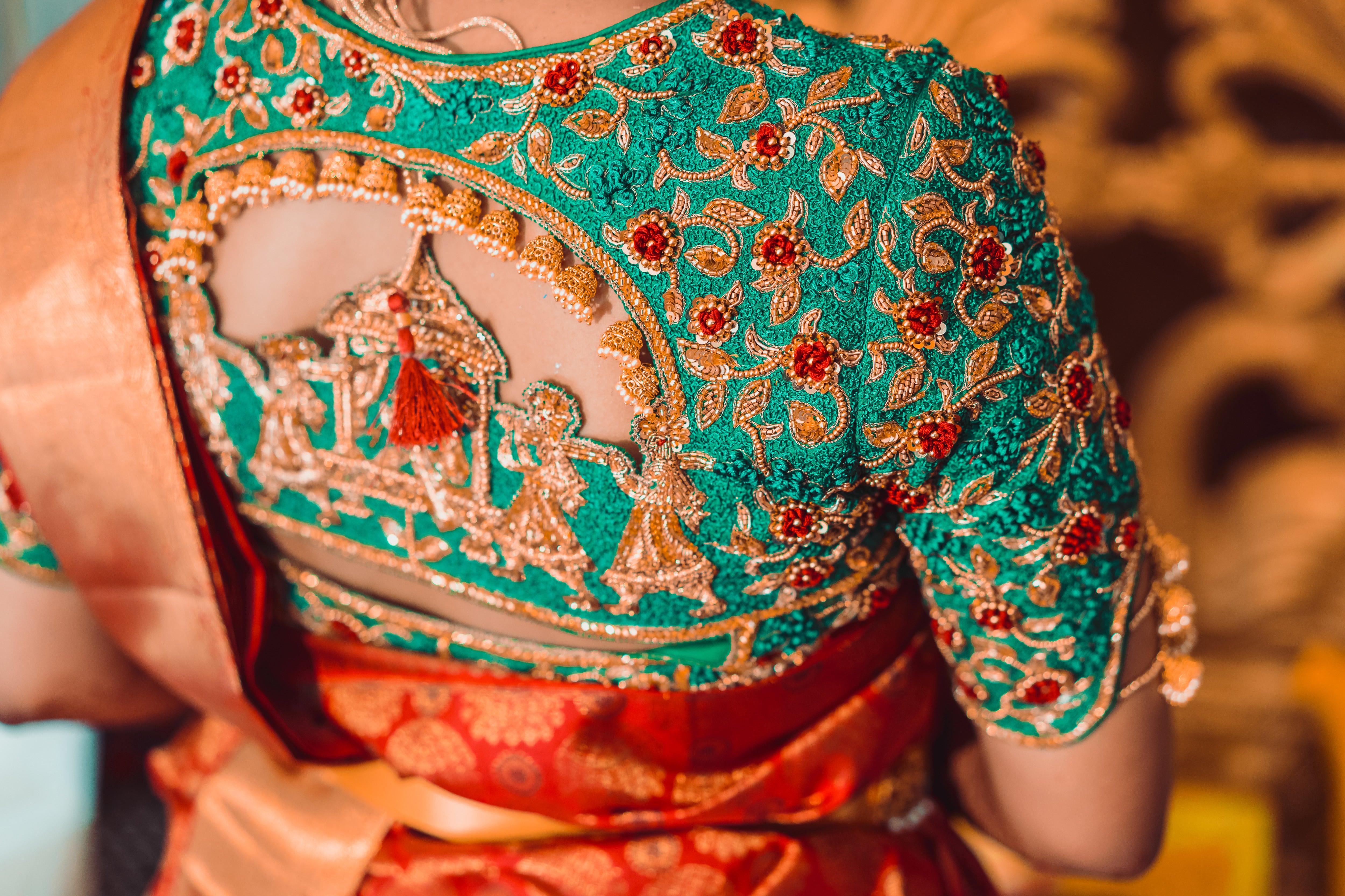 Bride Abhinaya in a handcrafted green raw silk blouse designed by Archana Karthick. Back blouse design of the palanquin bride design or doli design is captured here.