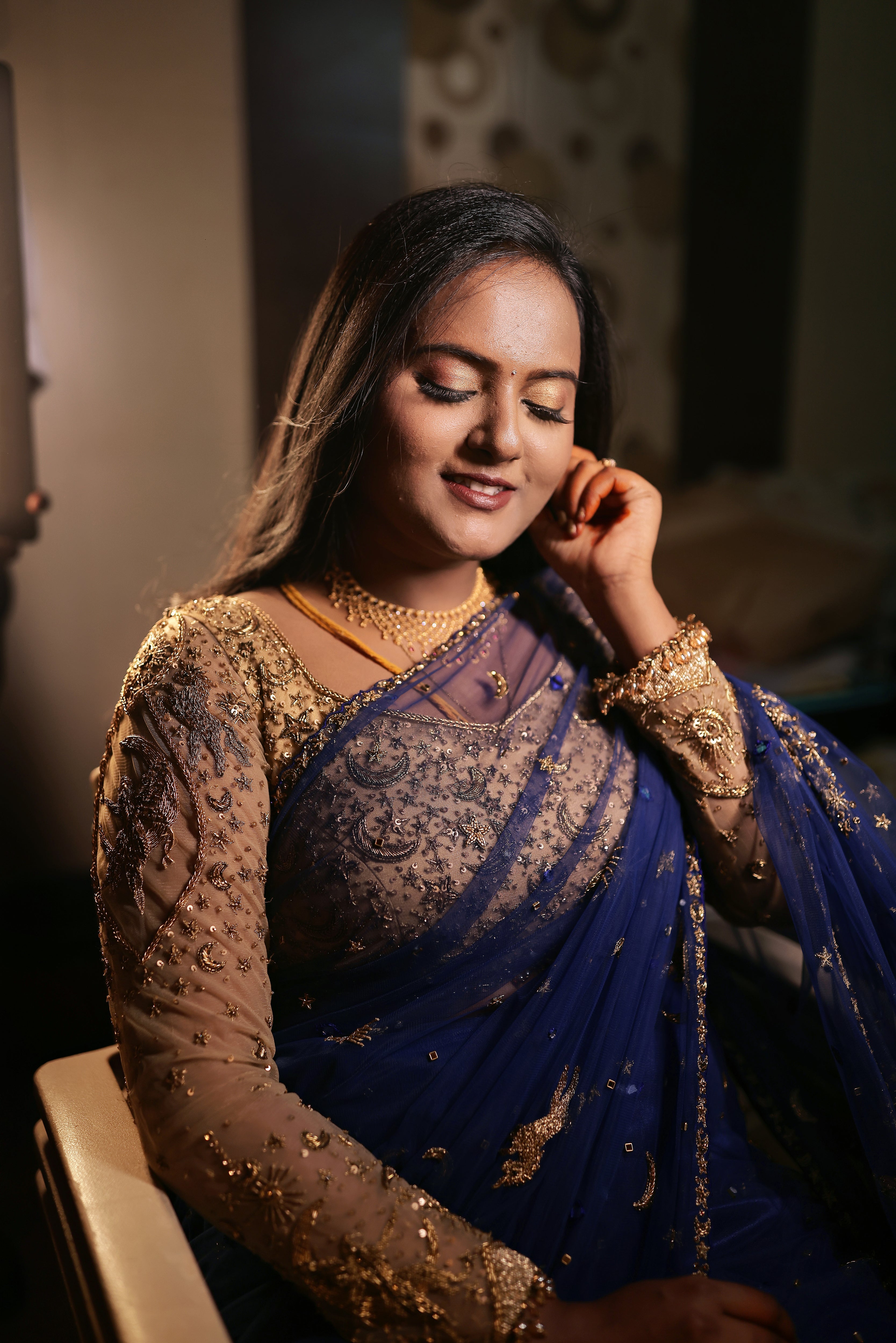 Bride Amirtha posing in a midnight blue tulle saree by team Archana Karthick.