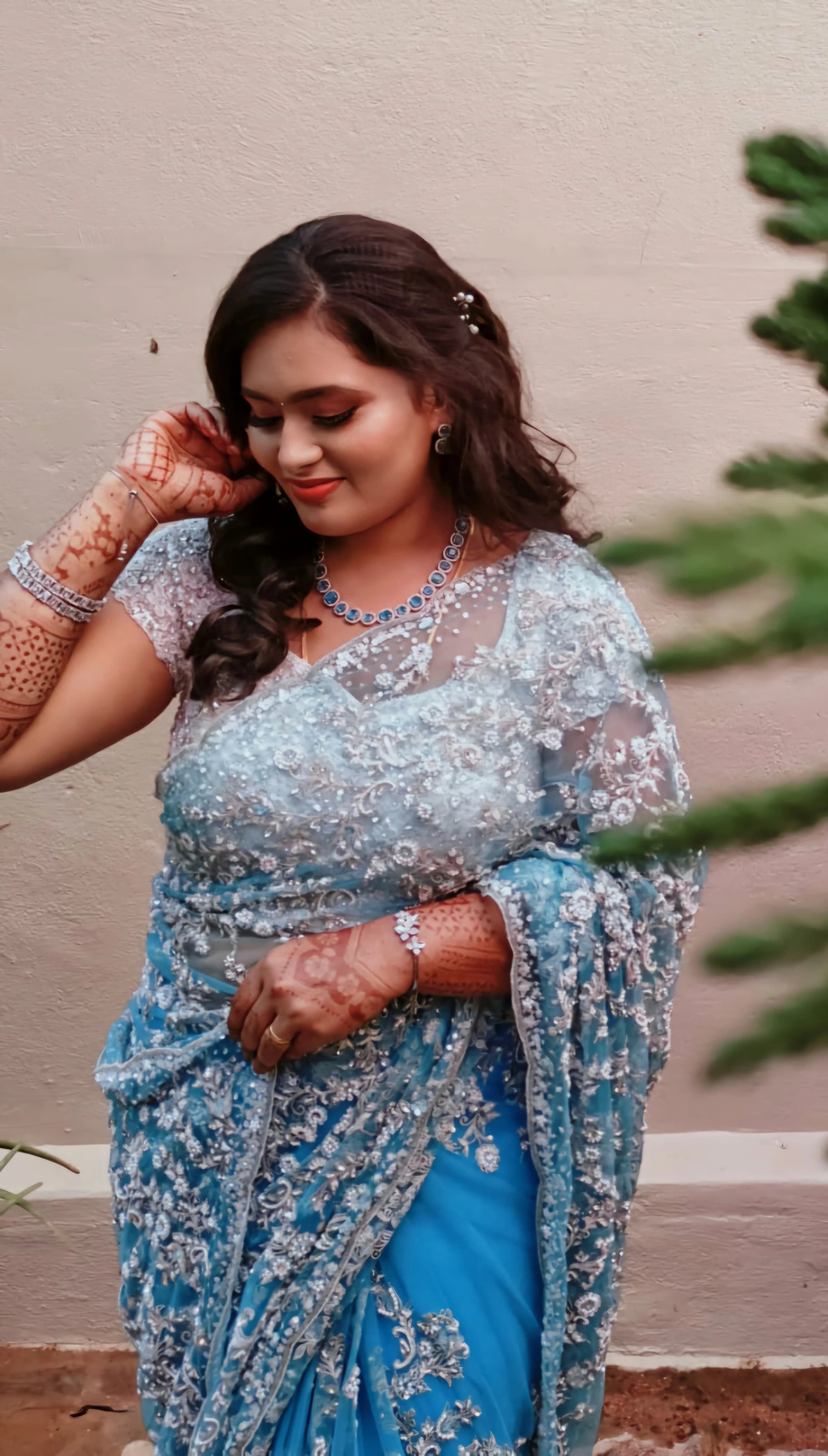 Bride Ananthi Christina in a blue tulle saree by team Archana Karthick.