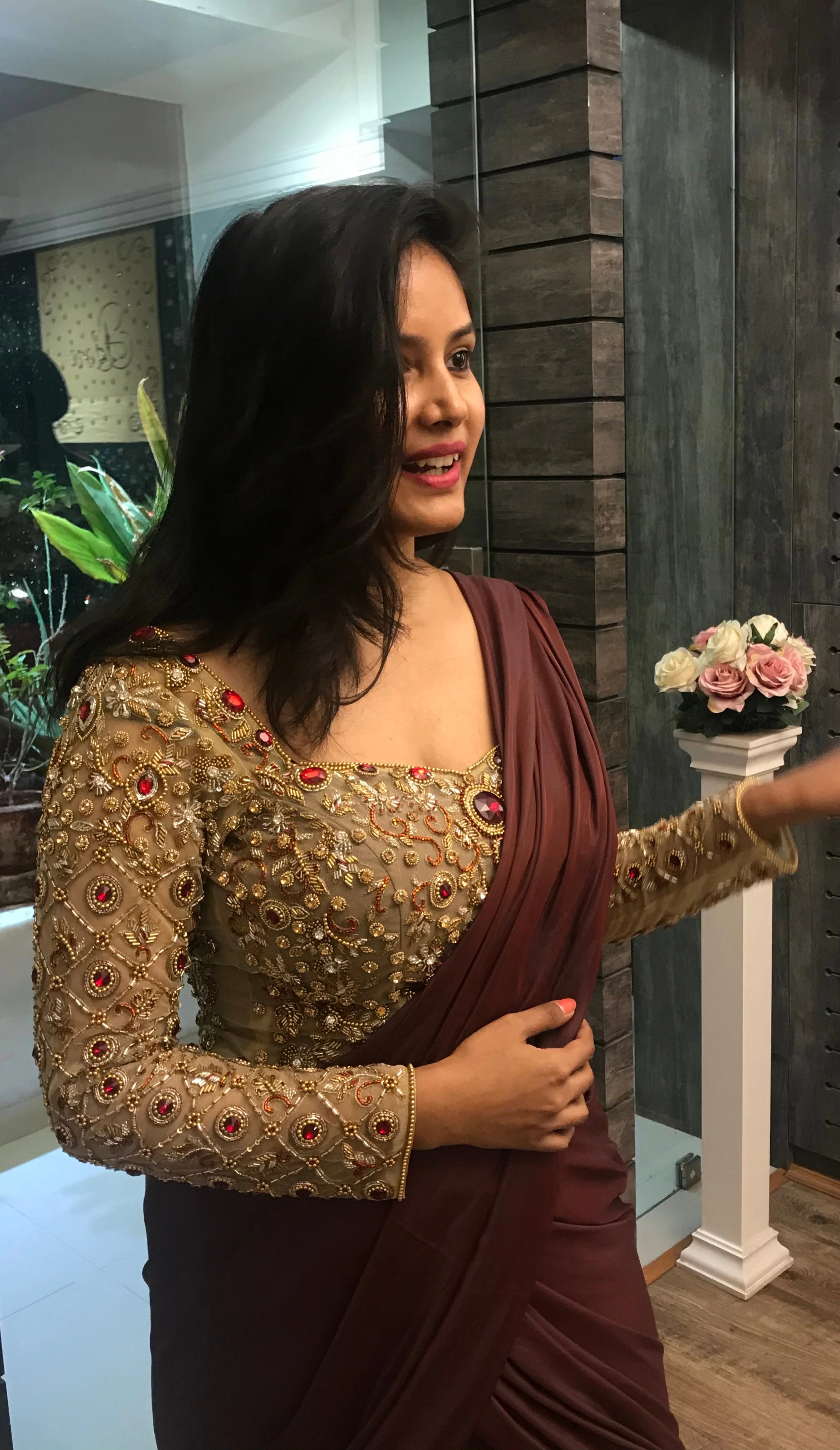 Bride Ankita in a champagne gold tulle blouse and brown mermaid saree handcrafted by team Archana Karthick.