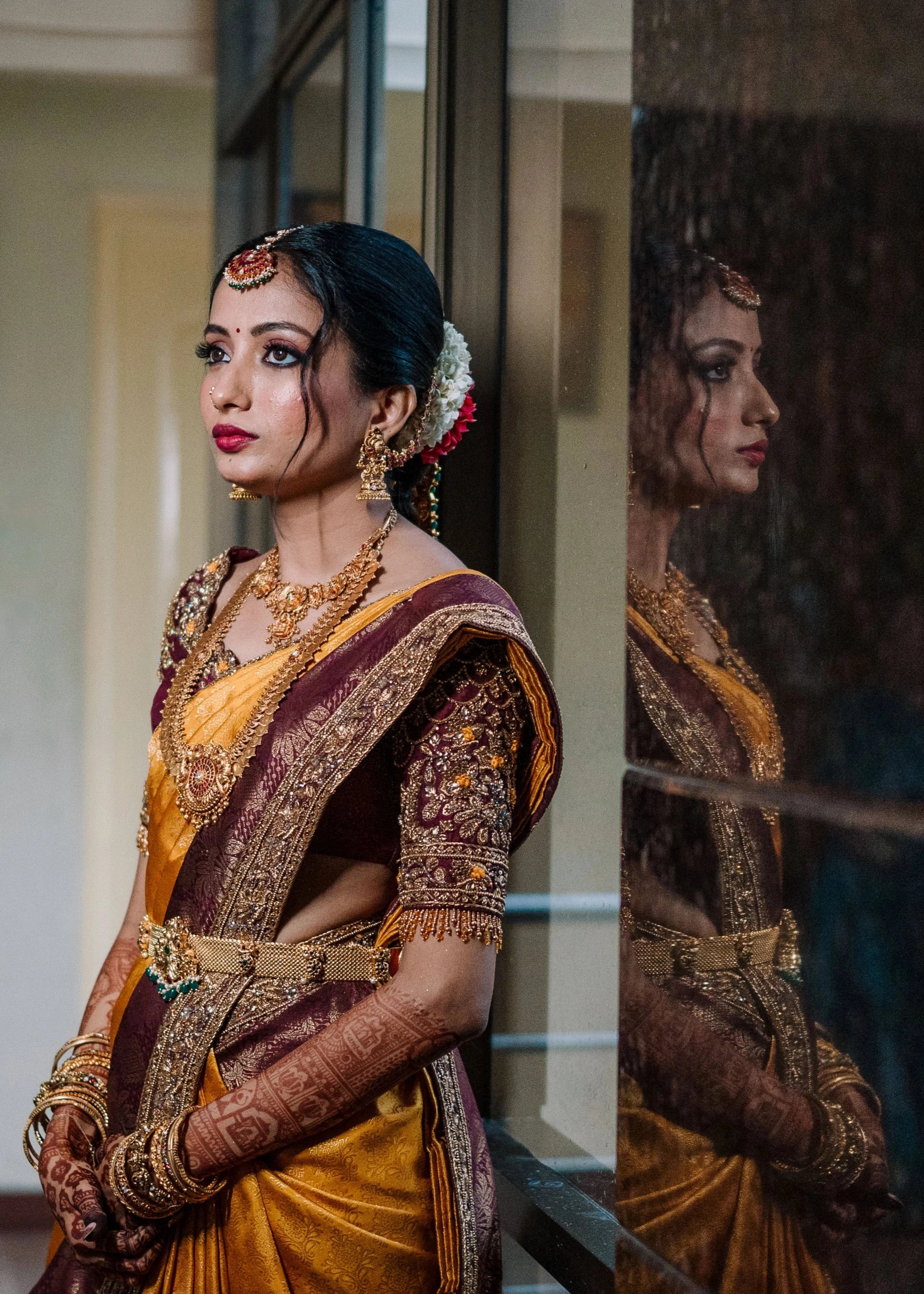 Bride Anusha K during photoshoot in a wine red concept raw silk blouse, veil and saree border, handcrafted with zardosi, beads, resham, crystals, sequins etc by Archana Karthick.