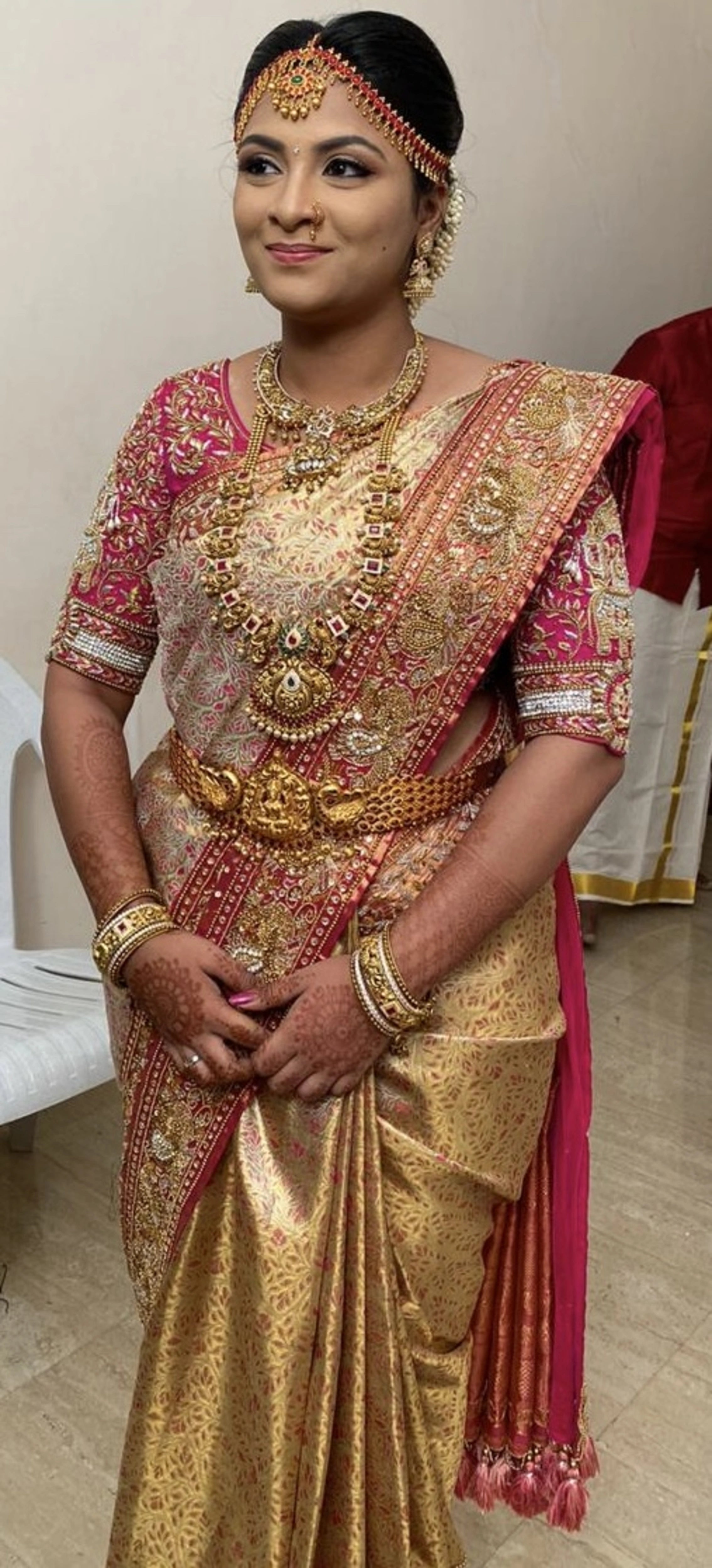 Bride Barani Lekha in an intricately handcrafted pink silk blouse and saree border with zardozi, beads, stones, sequins and hangings by team Archana Karthick.