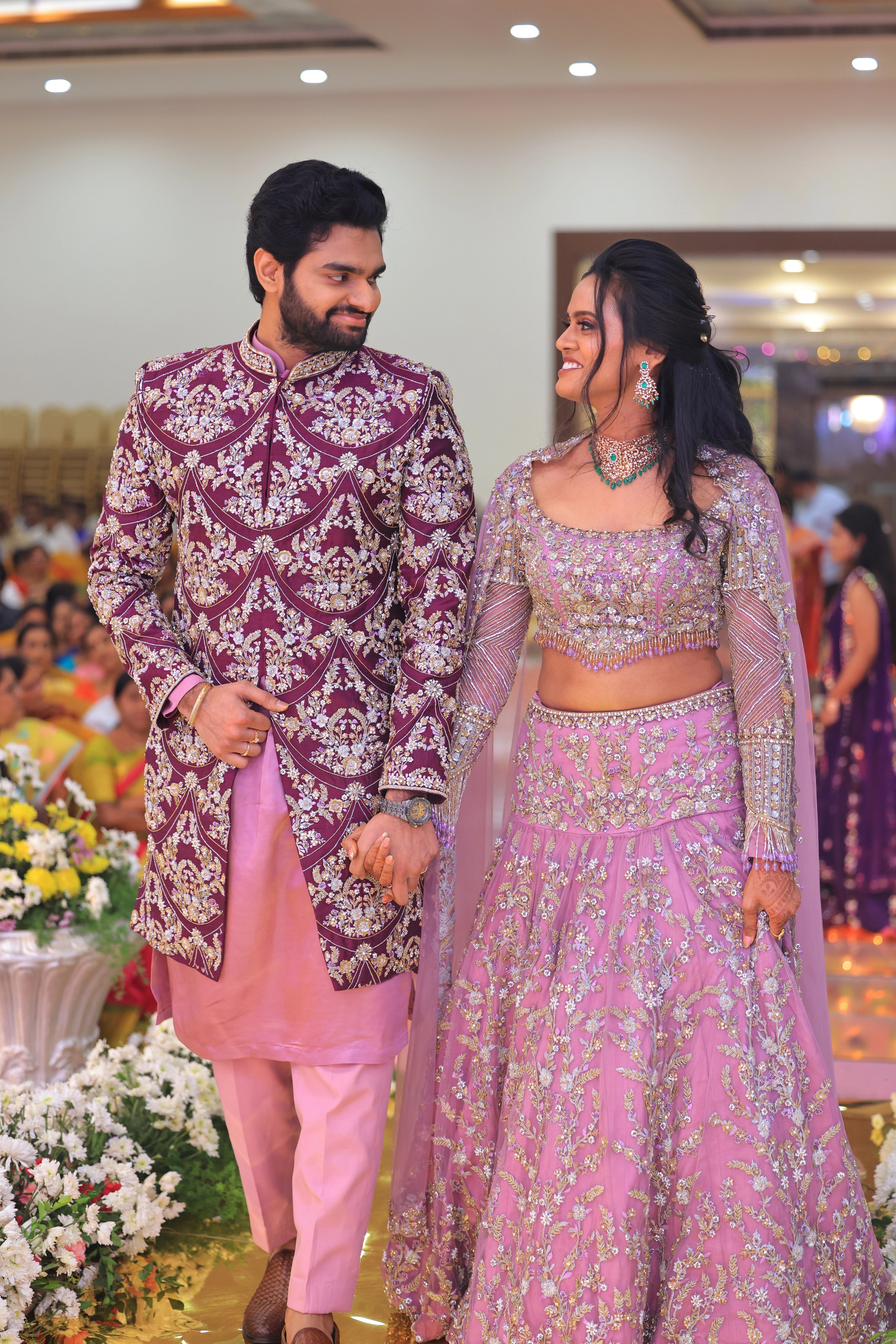 Bride Deepika smiling in lavender raw silk lehenga, intricately handcrafted with sequins, cutdana, beads, crystals, rhinestones and zardozi by team Archana Karthick.