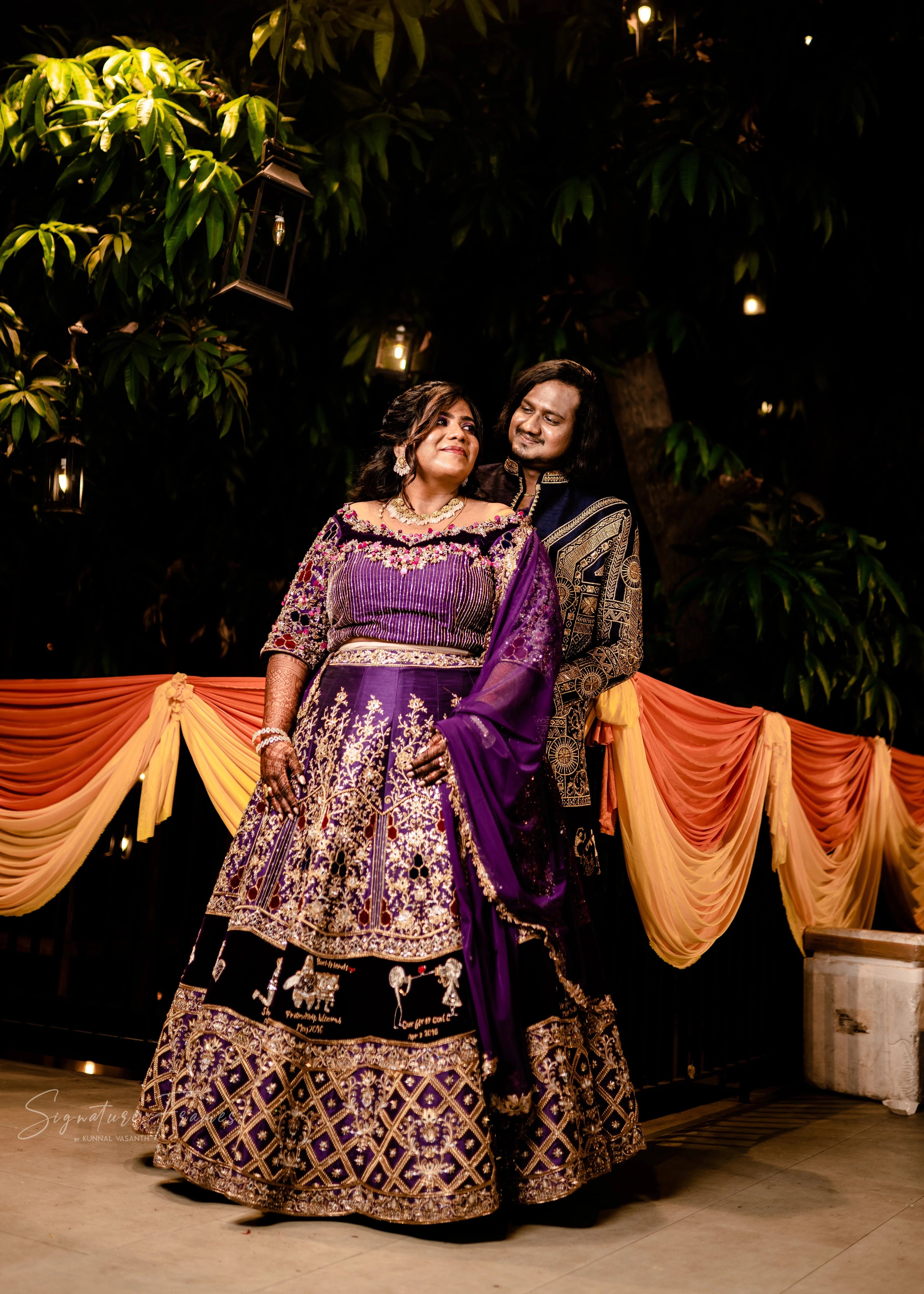 Bride & Groom in a purple raw silk lehenga and navy Indowestern outfit, handcrafted with mirrors, sequins, cutdana, beads and appliques by team Archana Karthick