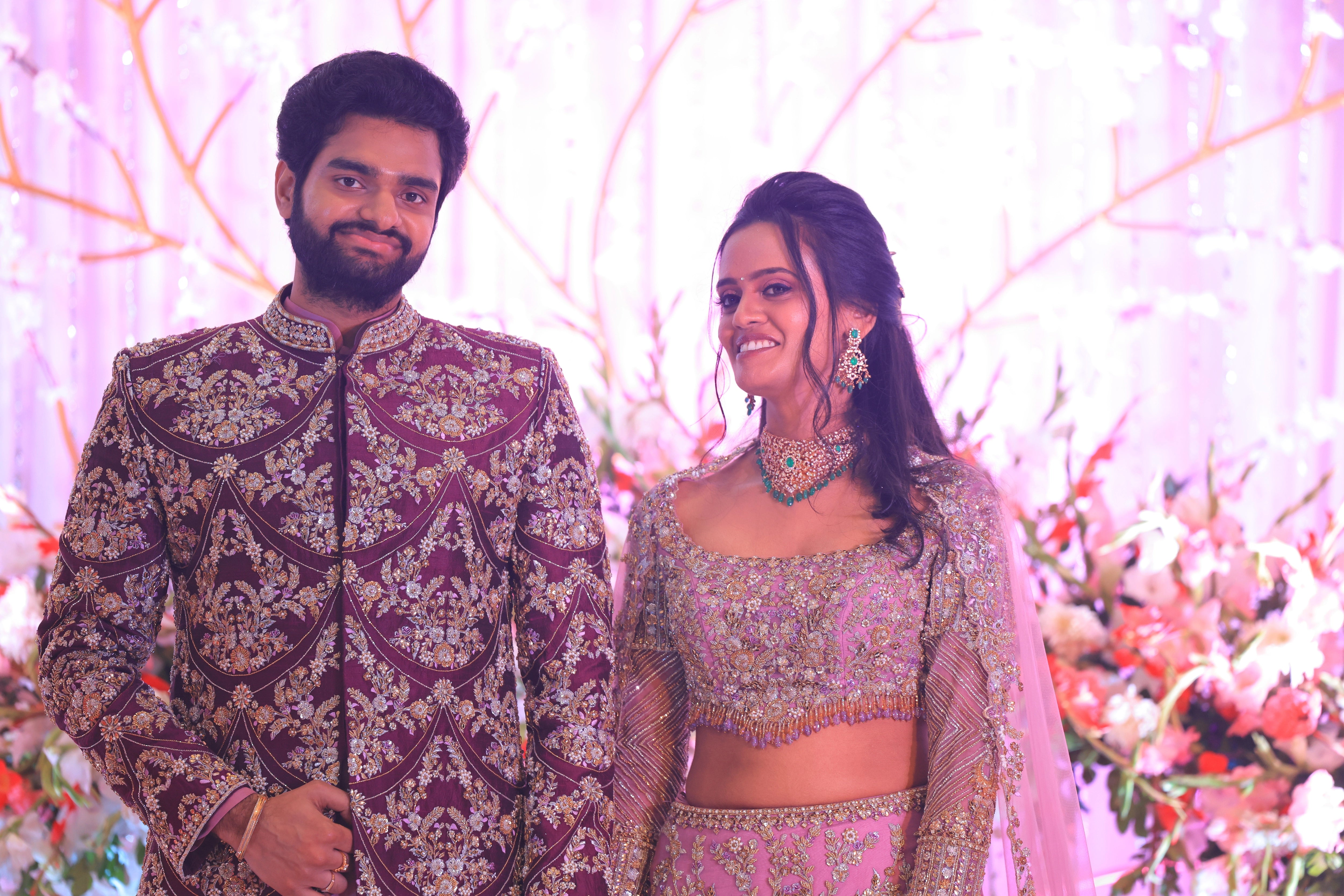 Bride & Groom looking happy in lavender raw silk lehenga and sherwani, handcrafted with sequins, cutdana, beads, crystals, rhinestones and zardozi by Archana Karthick