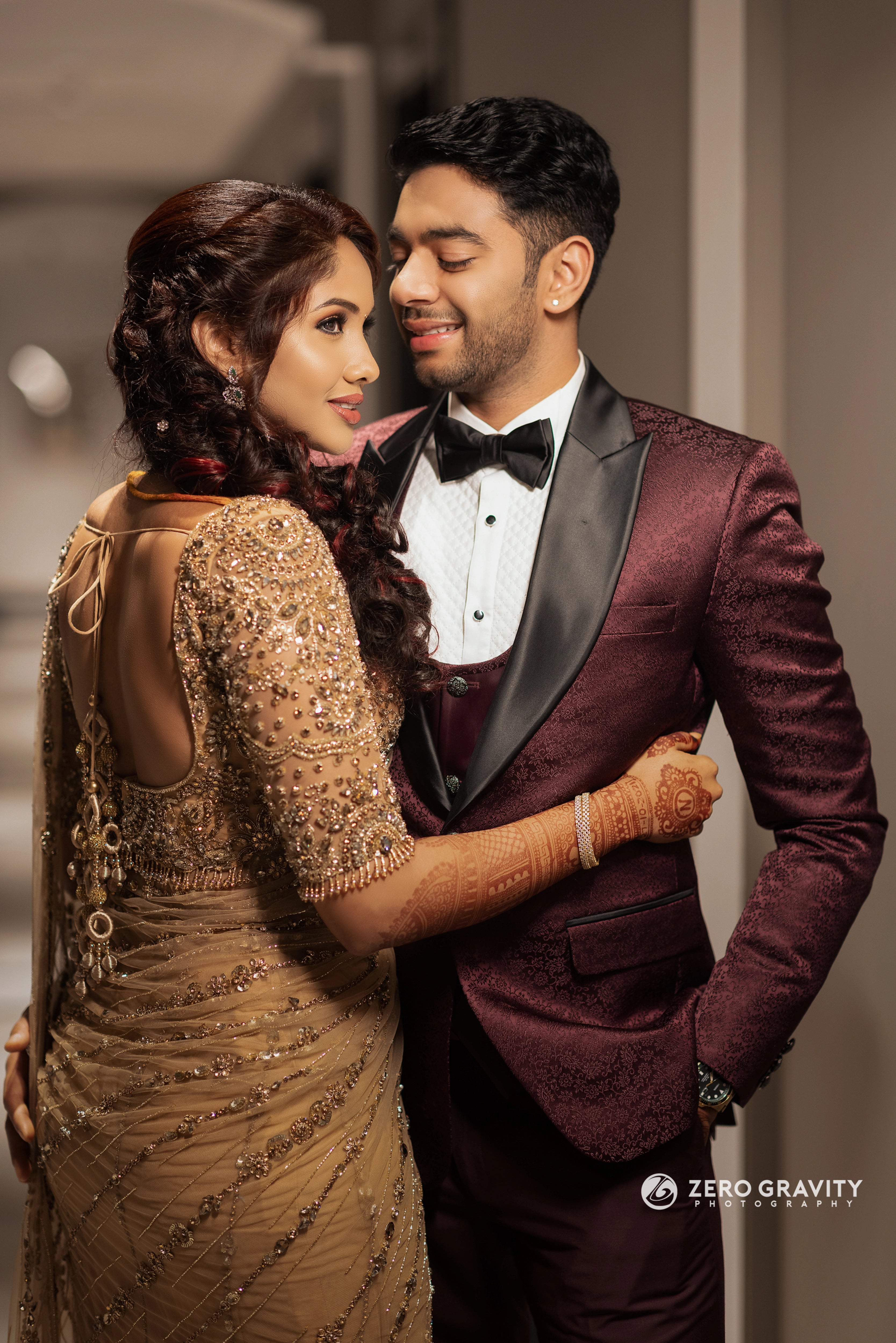 Bride Harine from San francisco with groom in a gold tulle saree, handcrafted with rhinestones, zardozi, sequins, crystals, cutdana and stones by team Archana Karthick.
