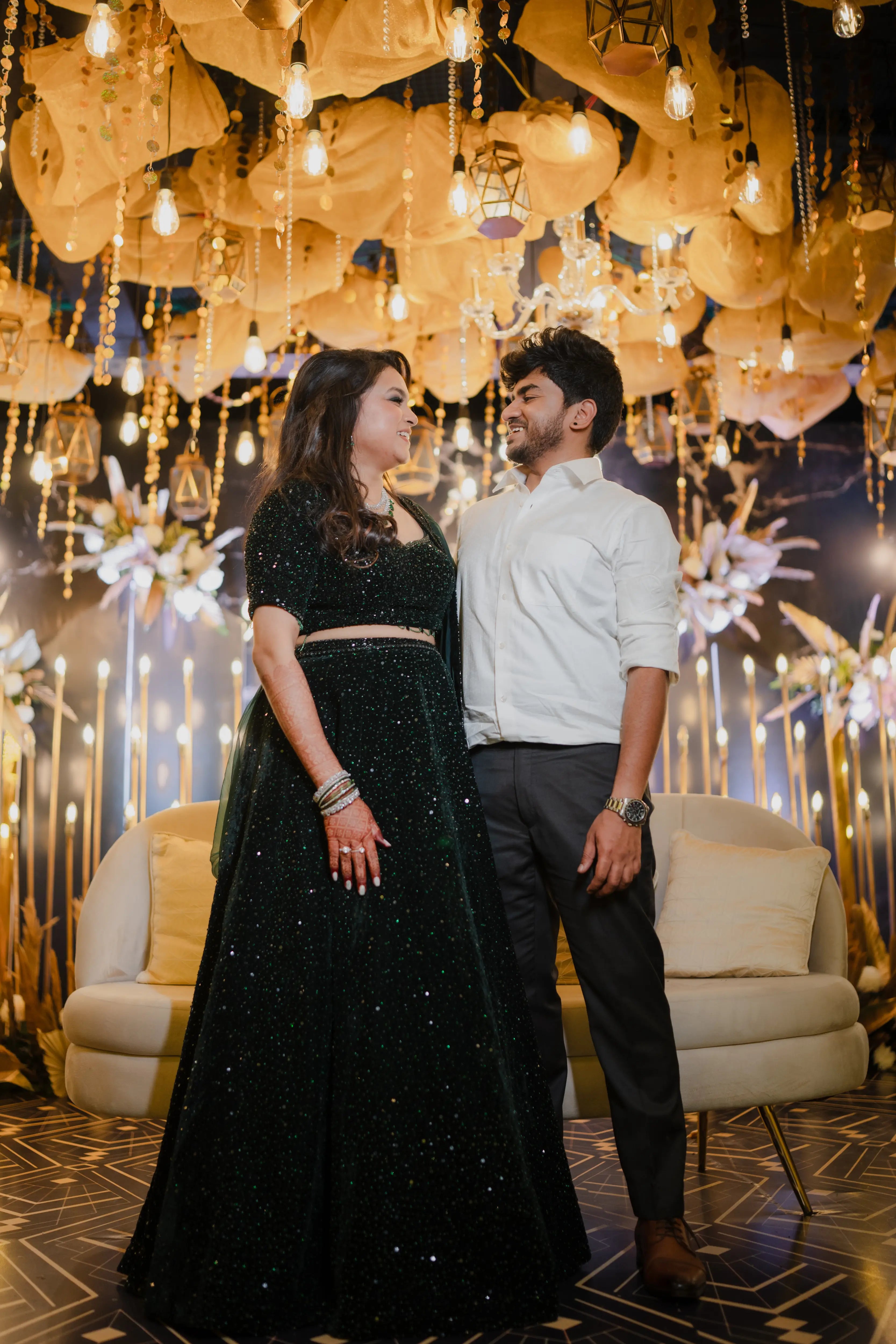 Bride Haripriya from USA with groom in a bottle green velvet lehenga, intricately handcrafted with sequins, cutdana, beads and crystals by team Archana Karthick.