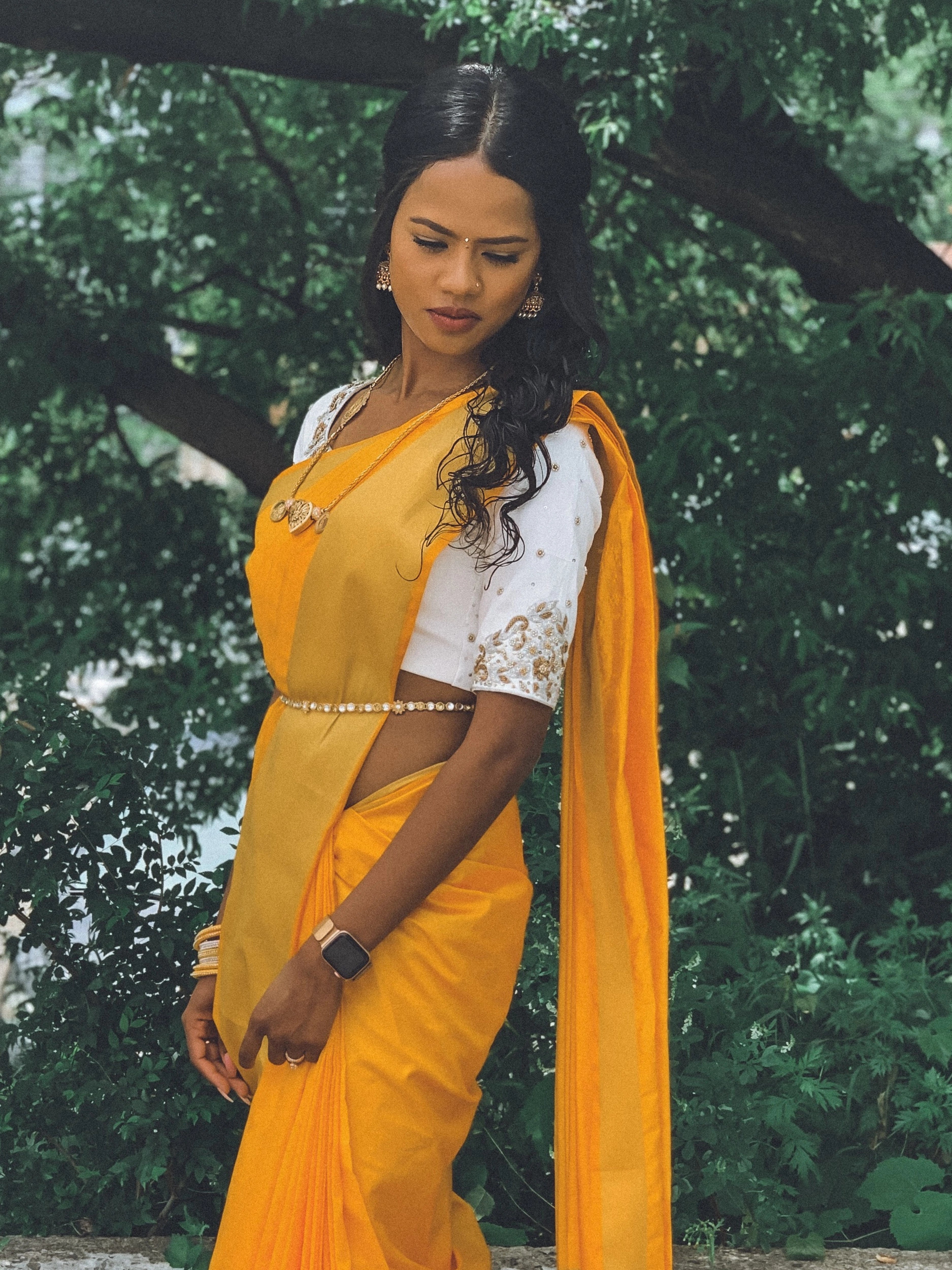 Bride Hemini from Canada in a white raw silk blouse handcrafted by team Archana Karthick.