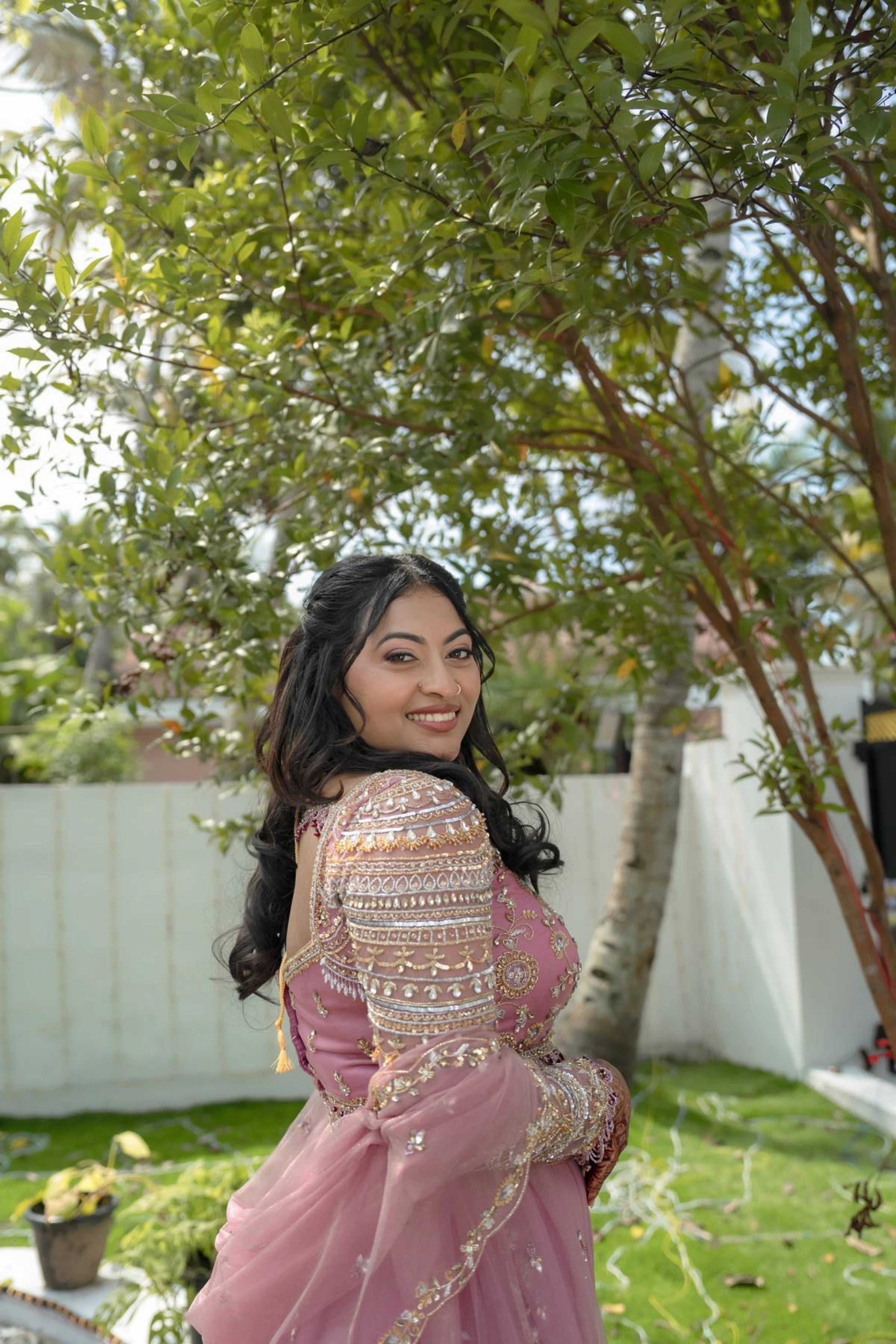 Bride Karoline from Qatar posing in a lilac tulle lehenga by team Archana Karthick.