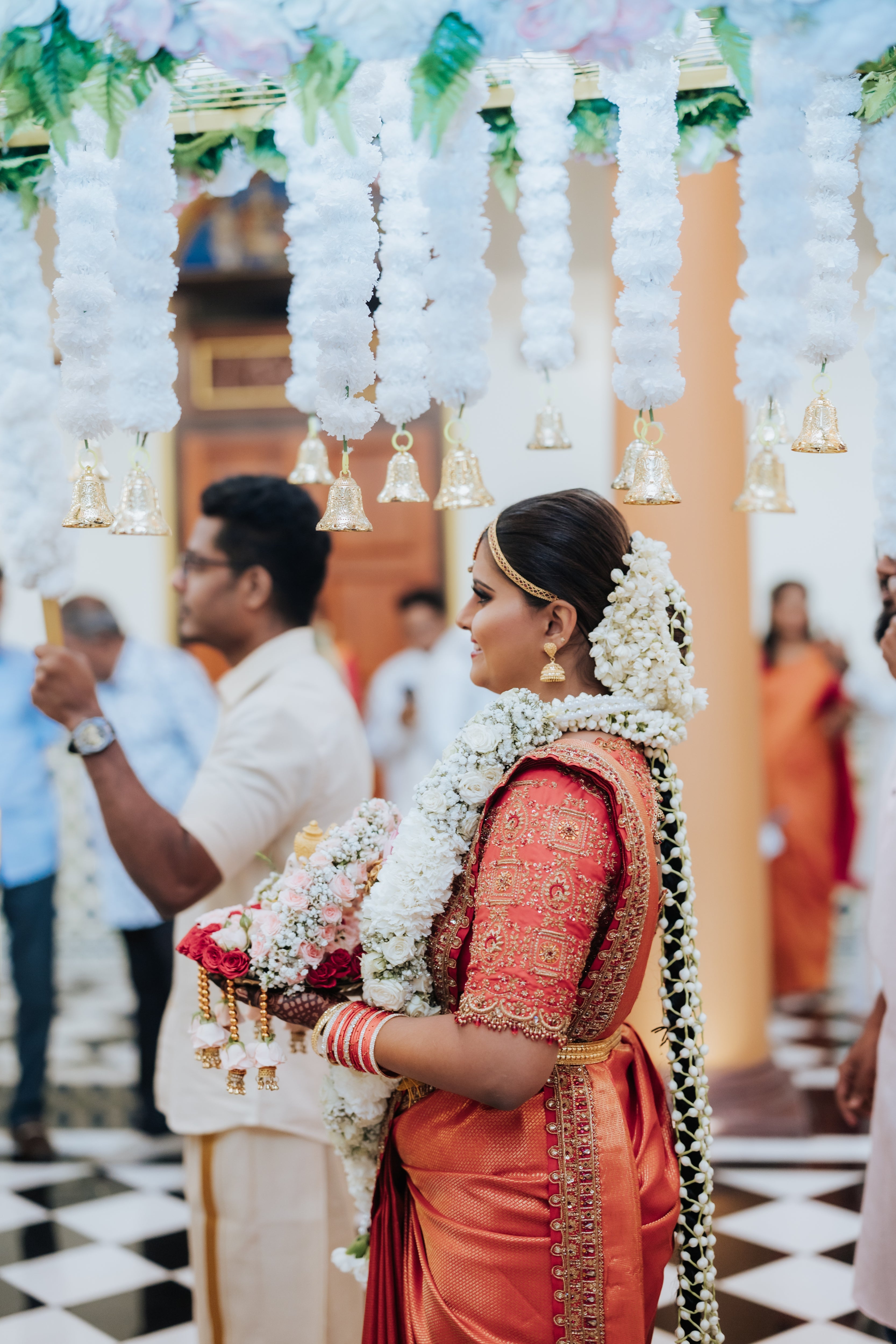 Bride Kritini Naidu from Malaysia in a red silk blouse & saree border by team Archana Karthick.