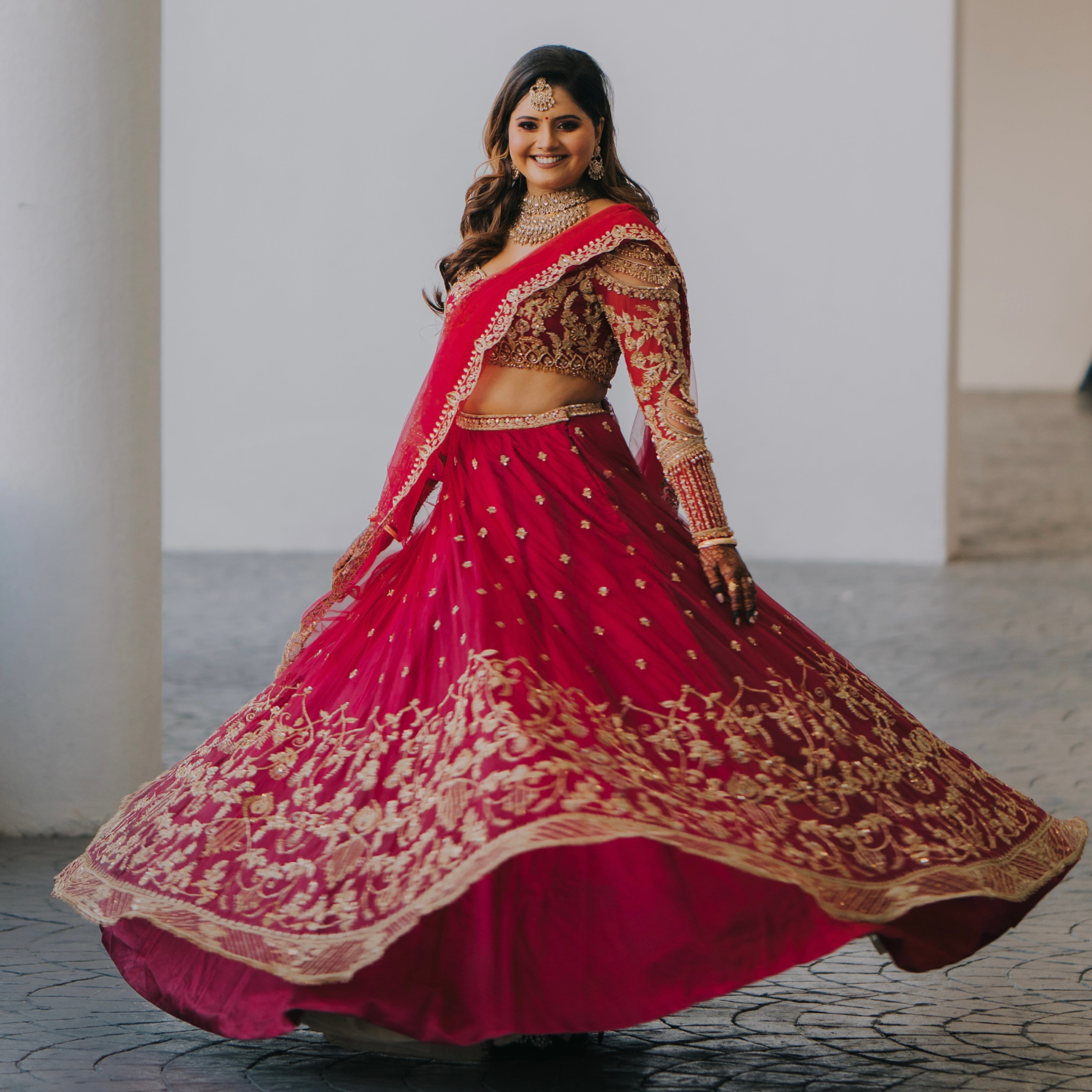 Bride Kritini Naidu from Malaysia twirling in a pink lehenga by Archana 