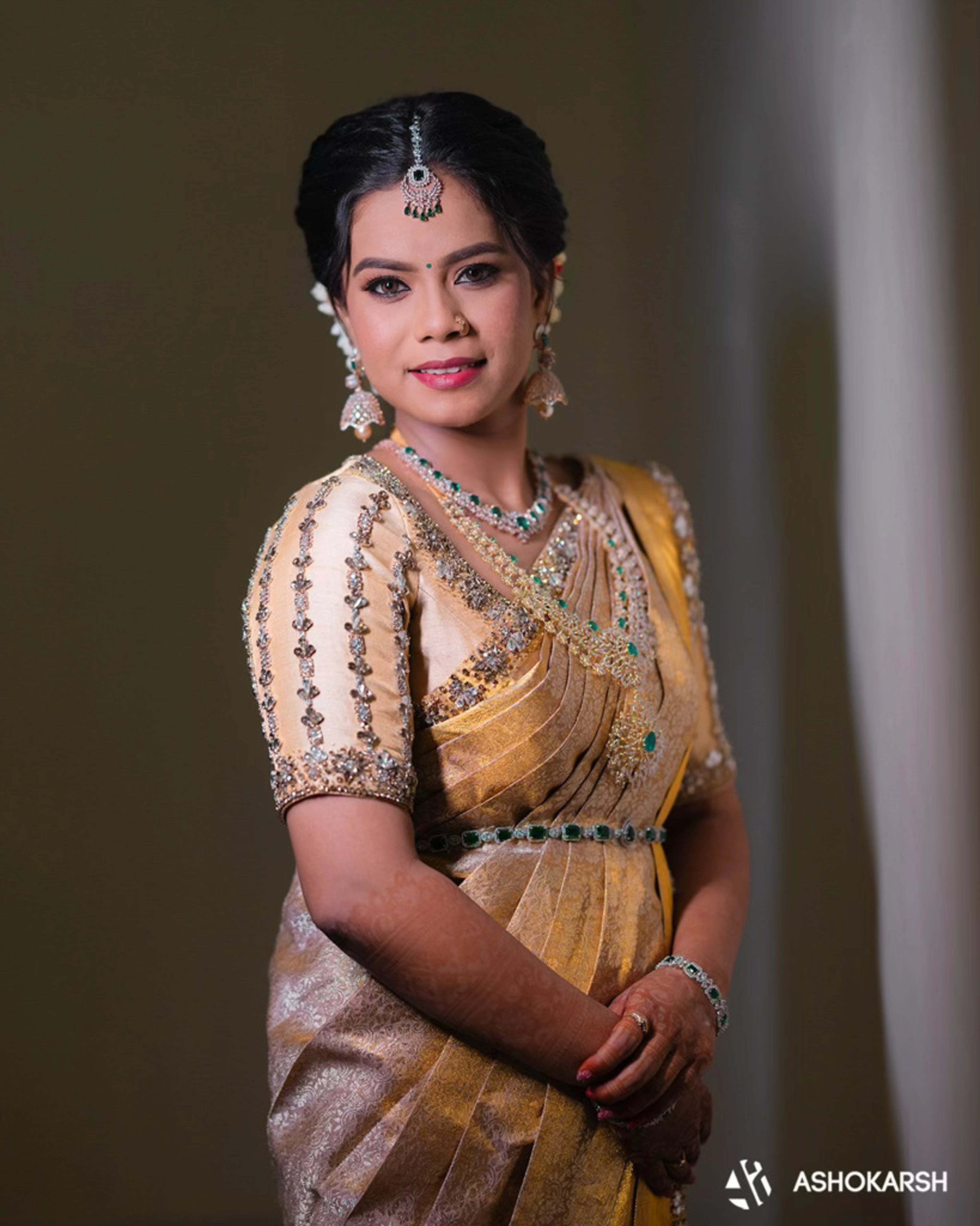Bride Kushmma posing for photoshoot in a silk blouse & saree border by Archana Karthick