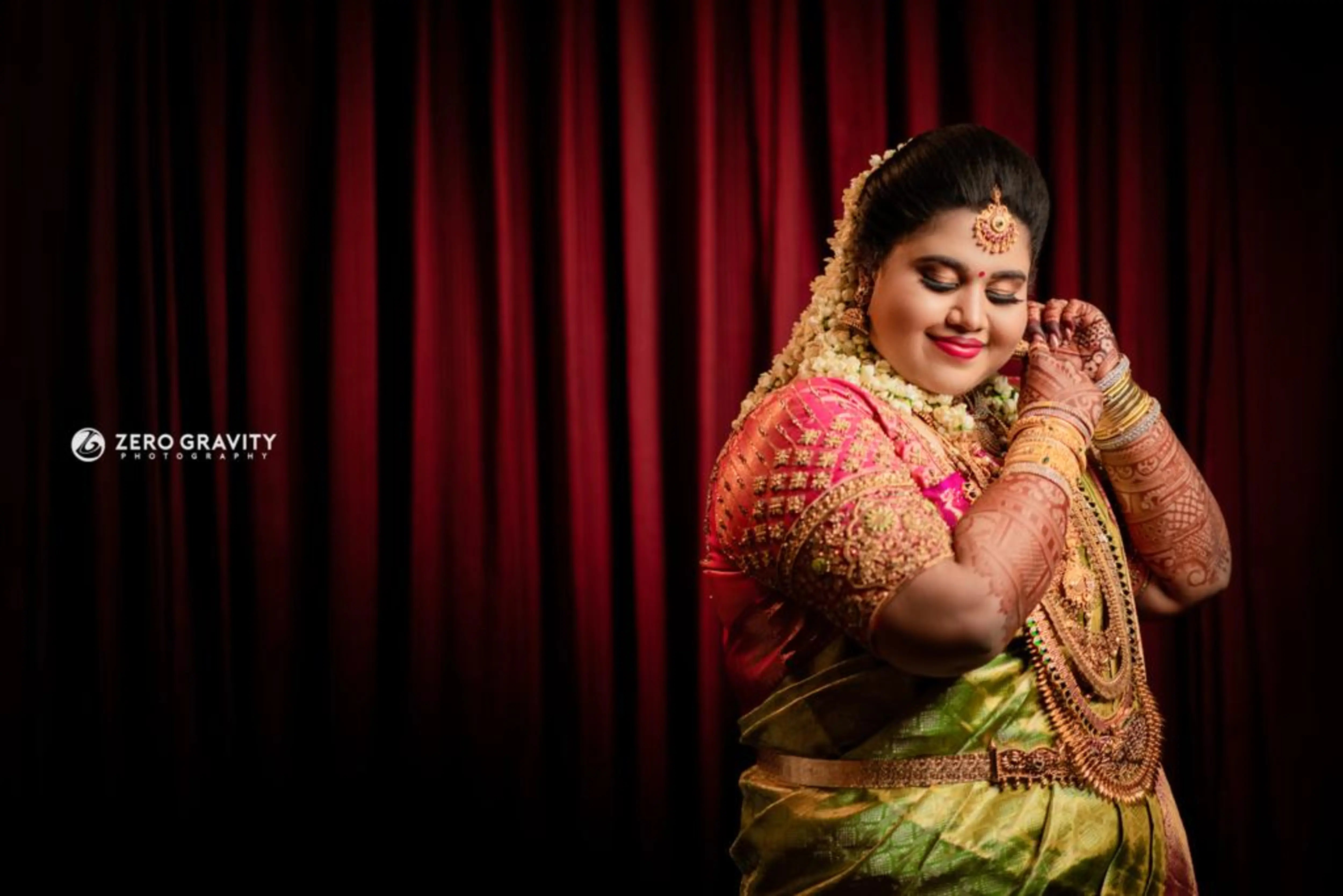 Bride Monisha from Kerala in a pink silk blouse by team Archana Karthick.