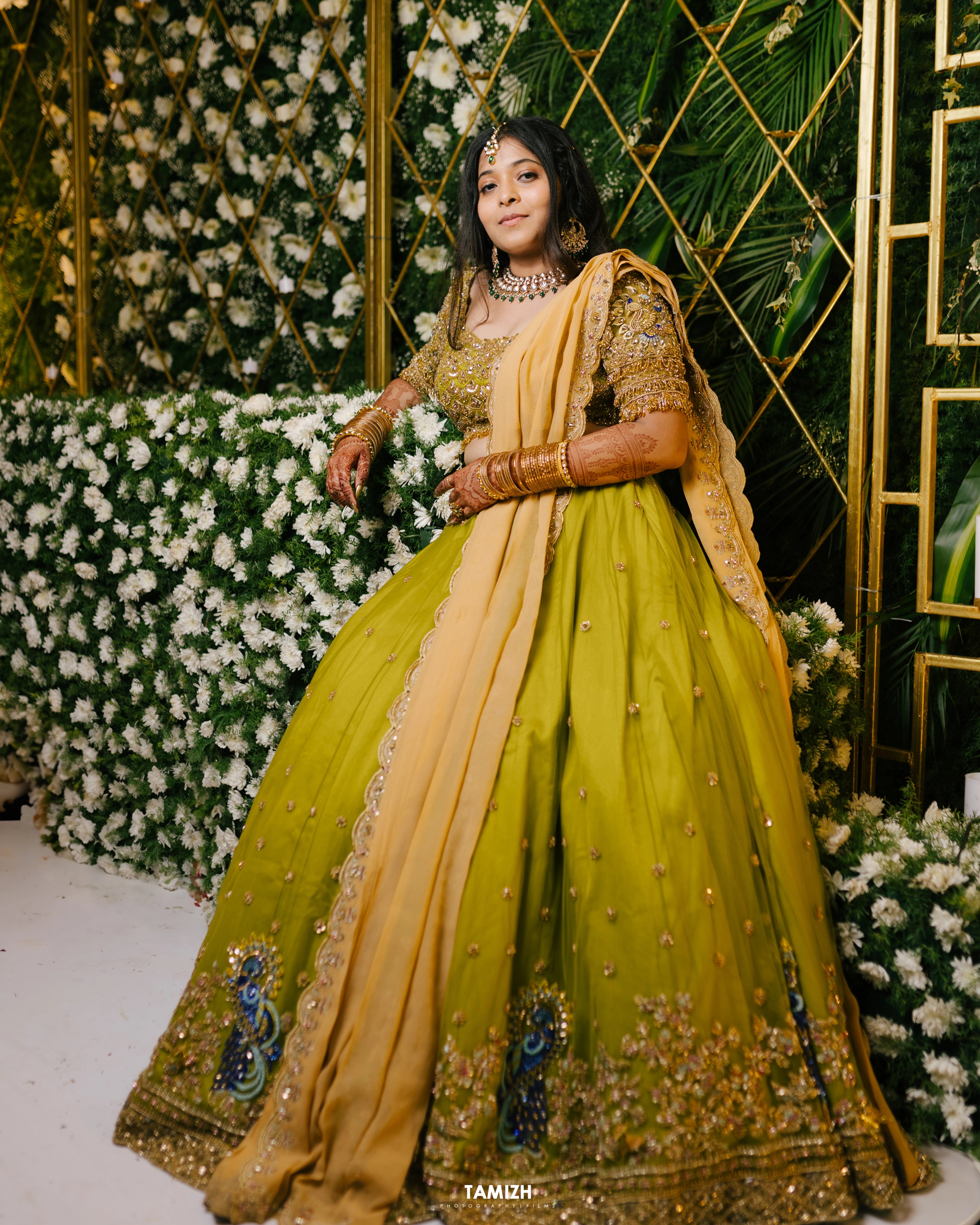 Bride Nandita in a olive green tulle lehenga by team Archana Karthick.