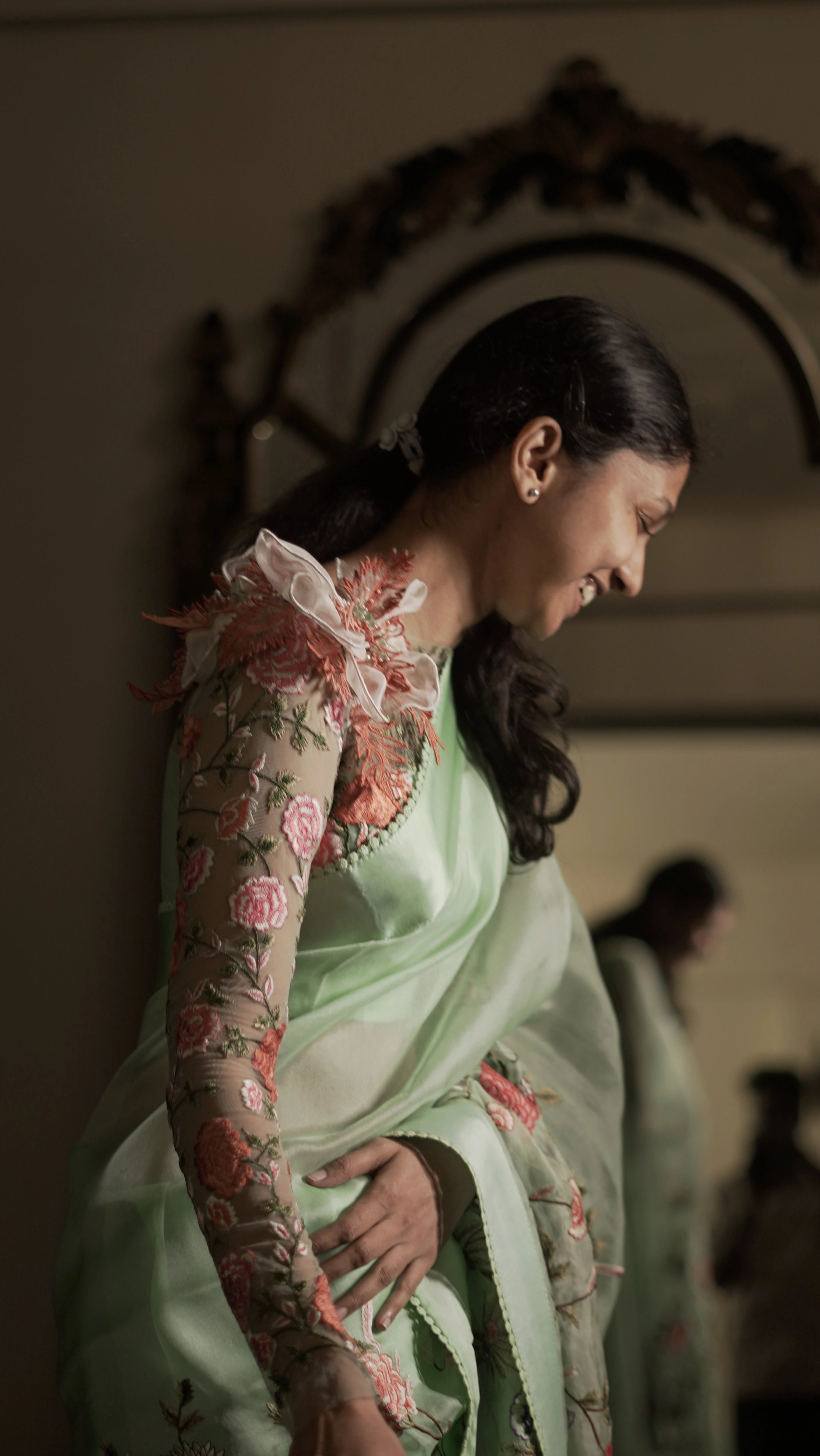 Bride Niveditha during fittings in a pastel pistachio green tulle blouse handcrafted by team Archana Karthick.