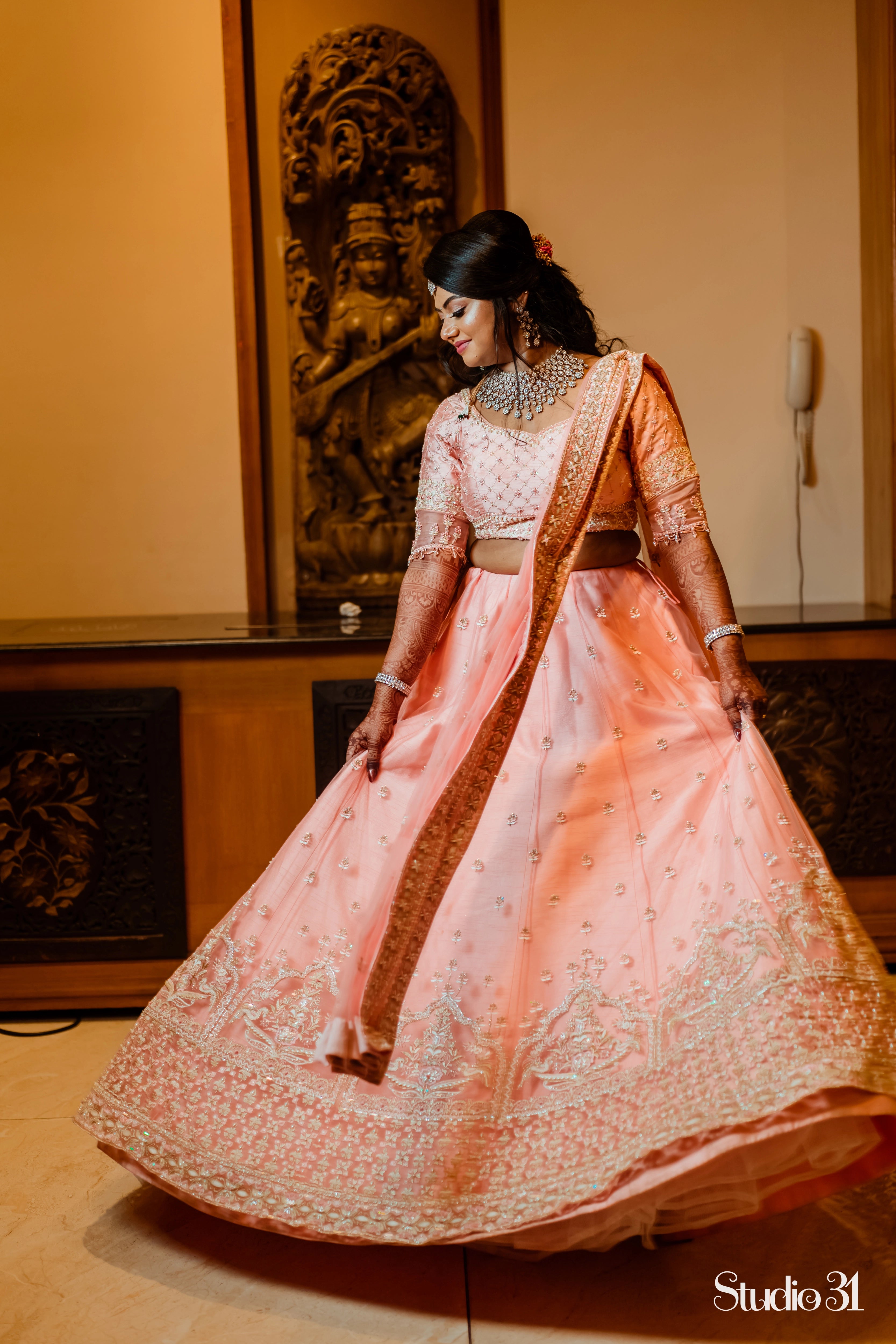 Bride Sailaja from USA in a peach cream raw silk lehenga, intricately handcrafted with pearls, sequins, cutdana, beads, zari and resham by team Archana Karthick.