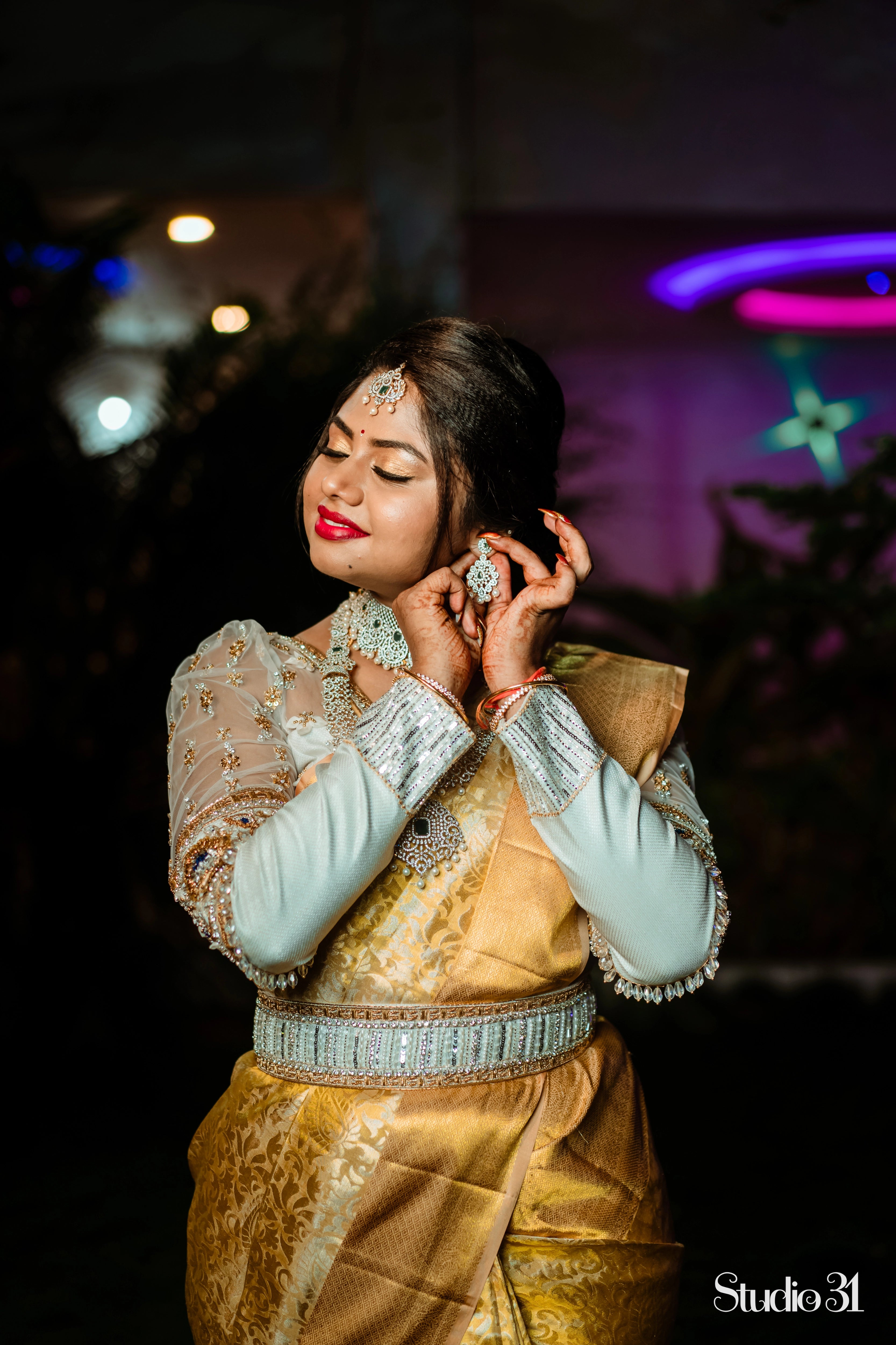 Bride Sailaja from USA in an ivory tulle and silk blouse and belt, intricately handcrafted by team Archana Karthick.
