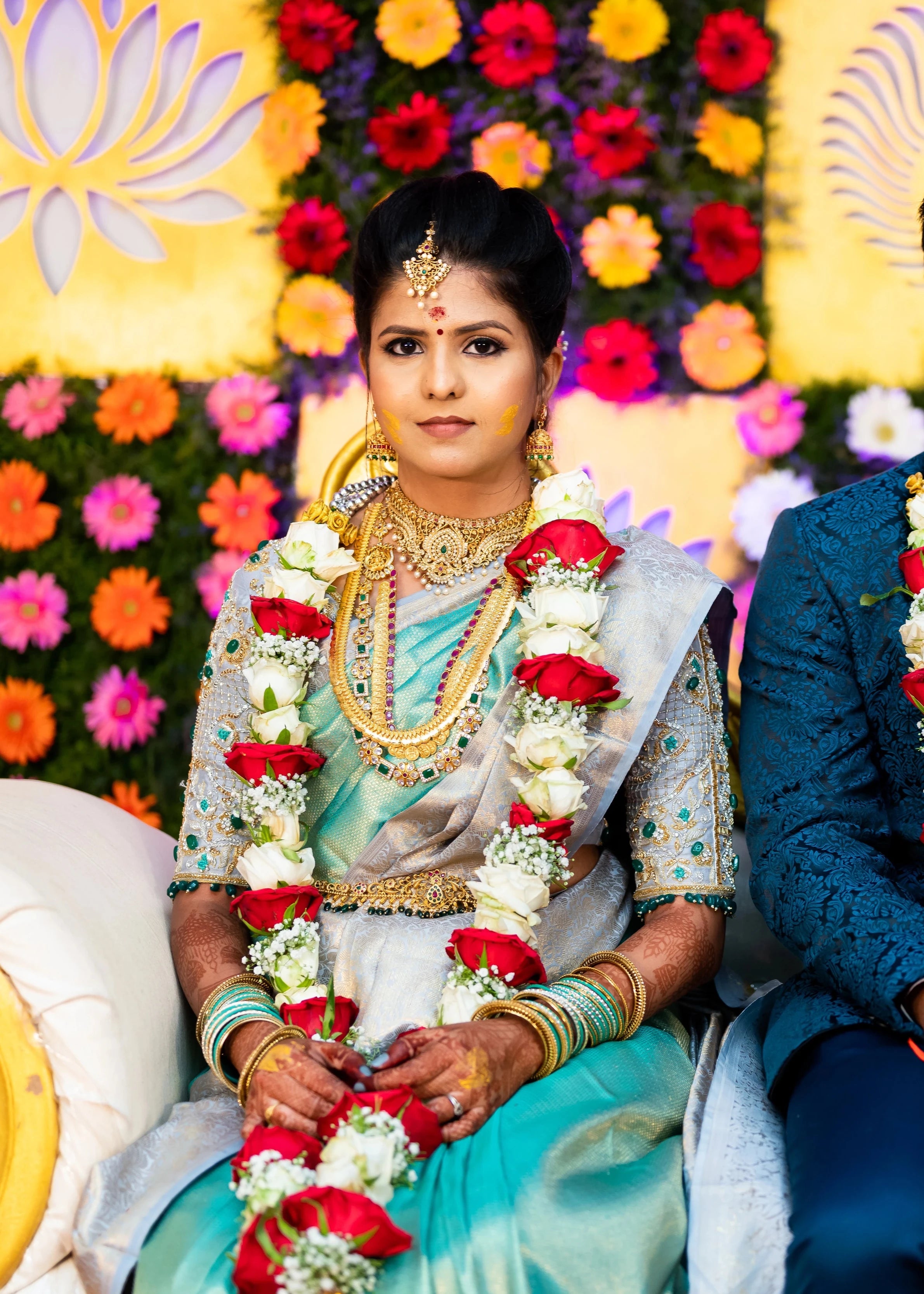 Bride Sarumathi in a powder blue silk blouse, intricately handcrafted with zardozi, resham, stones and cutdana by team Archana Karthick.