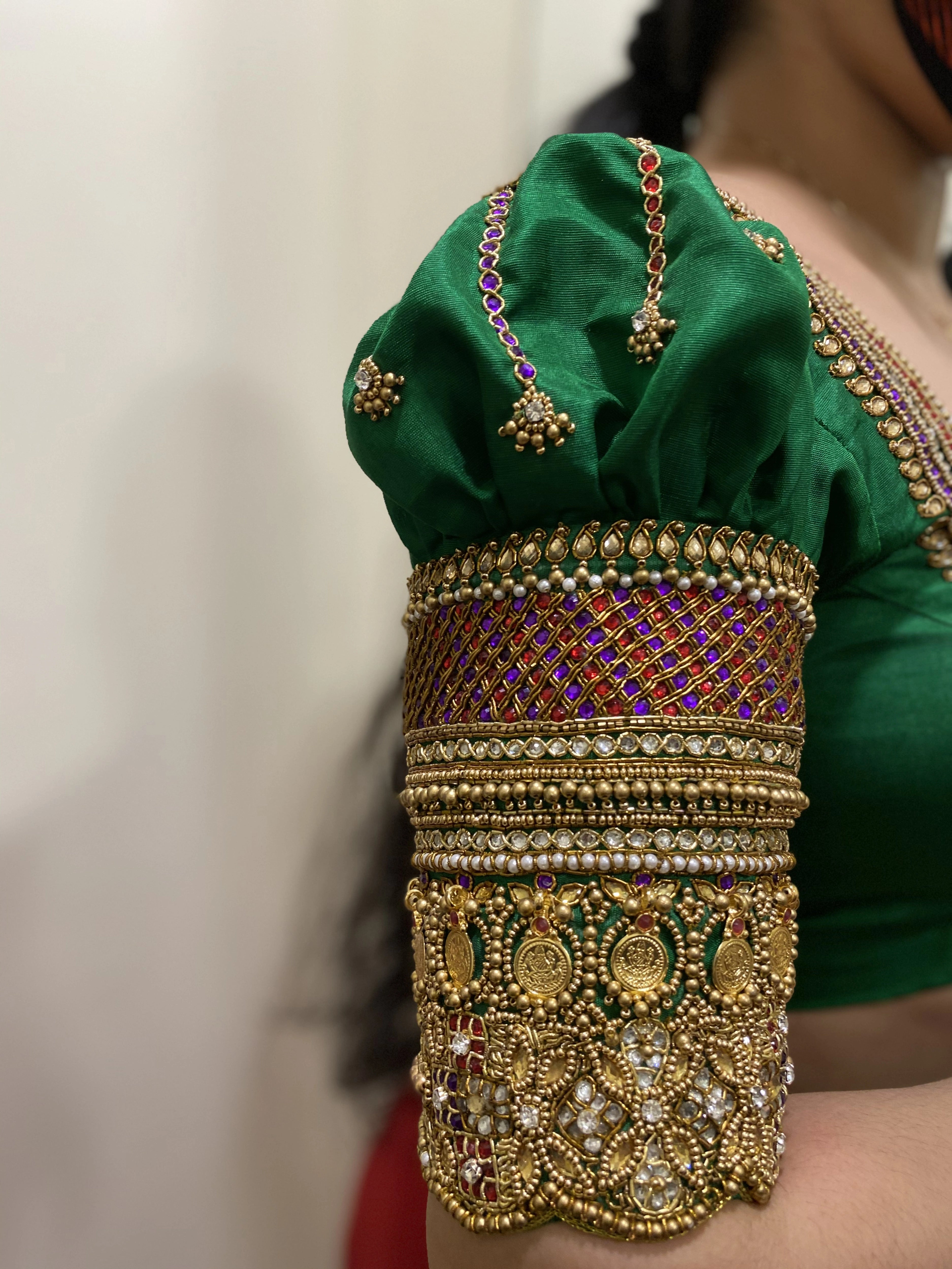 Bride Shalini from Kerala during fittings in a green silk blouse embellished by team Archana Karthick.