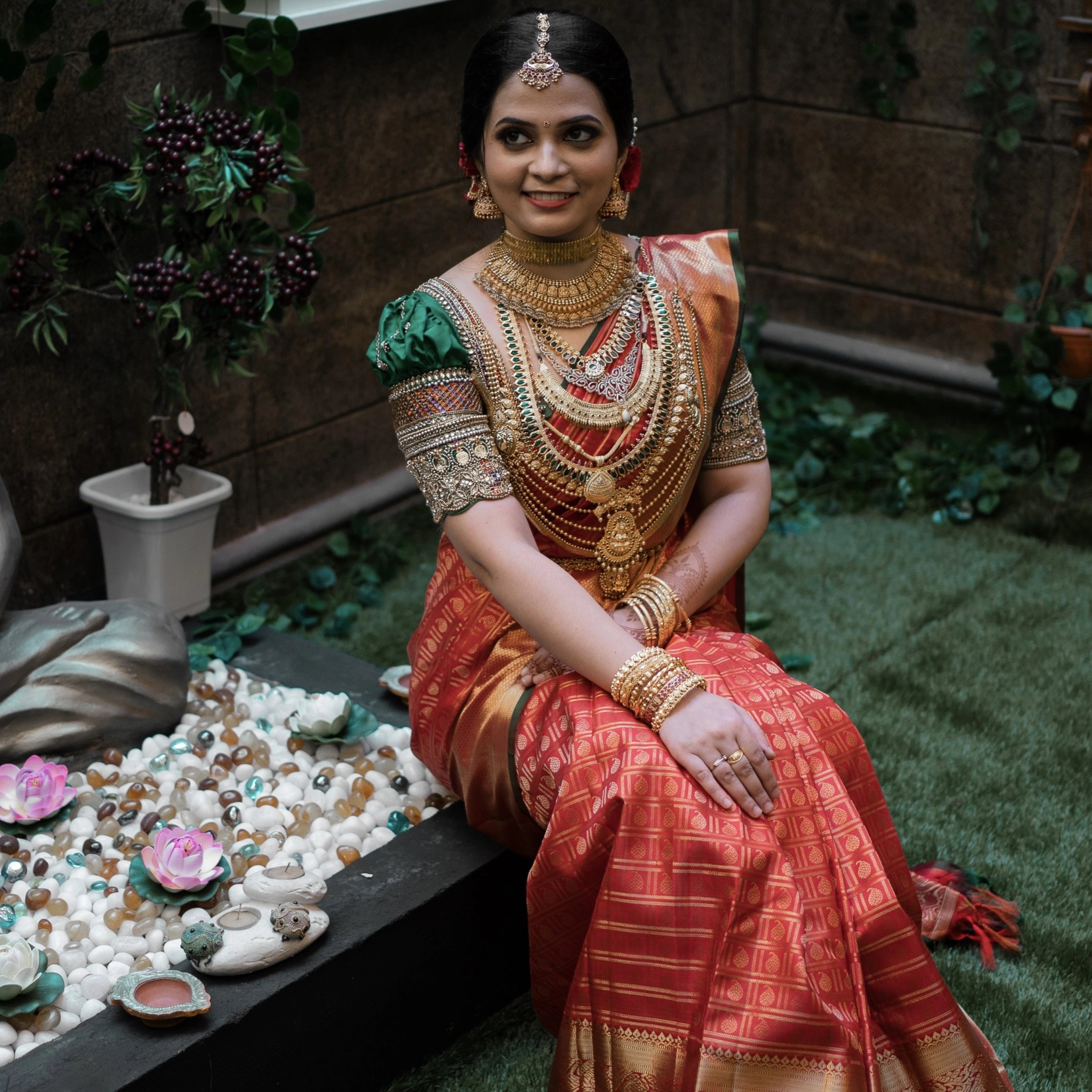 Bride Shalini from Kerala in a handcrafted green silk blouse embellished with beads, zardozi, kundan, kemp stones, coins & pearls by team Archana Karthick.