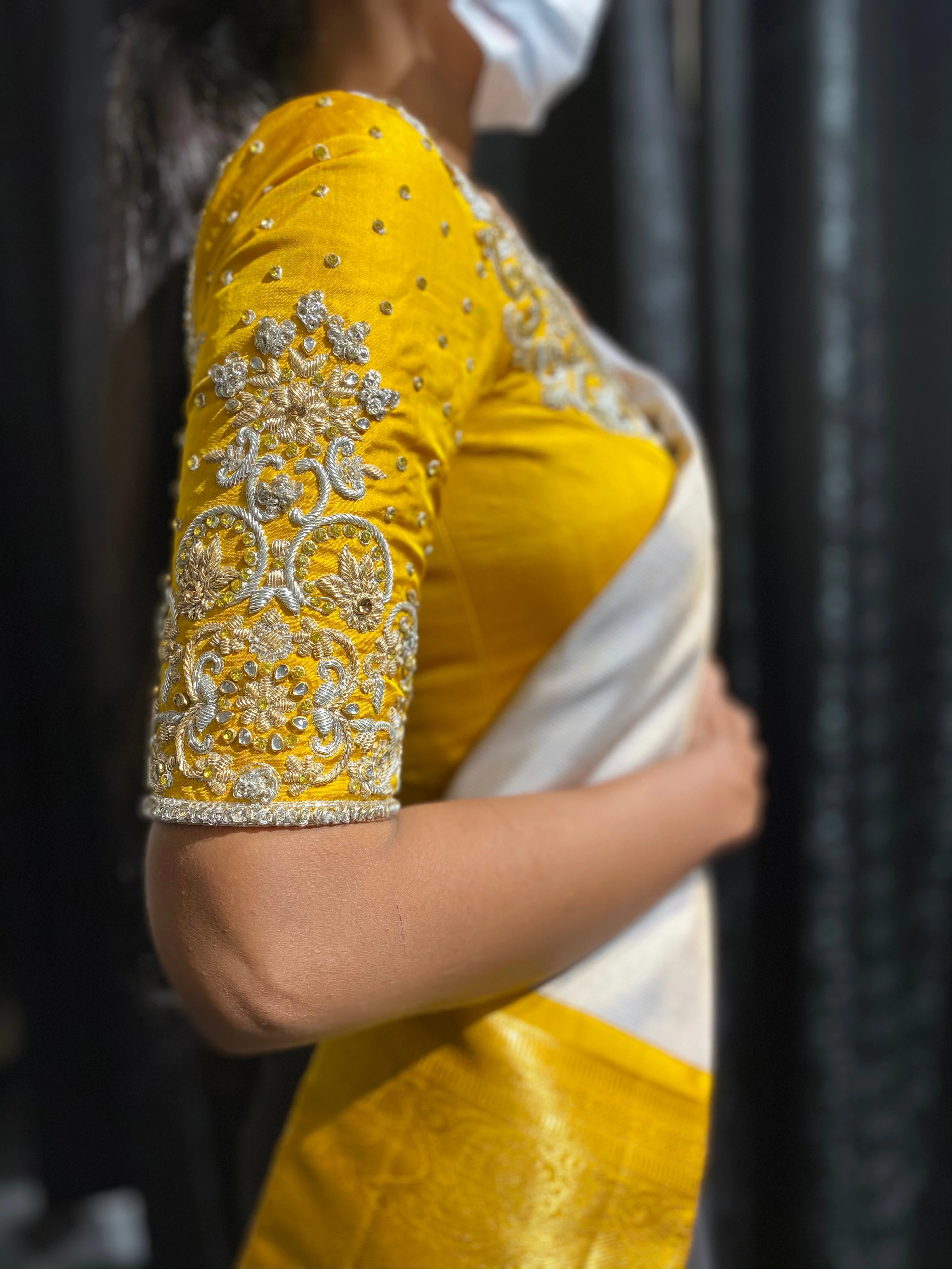 Bride Shanmugapriya during her fittings in a yellow silk blouse by team Archana Karthick.