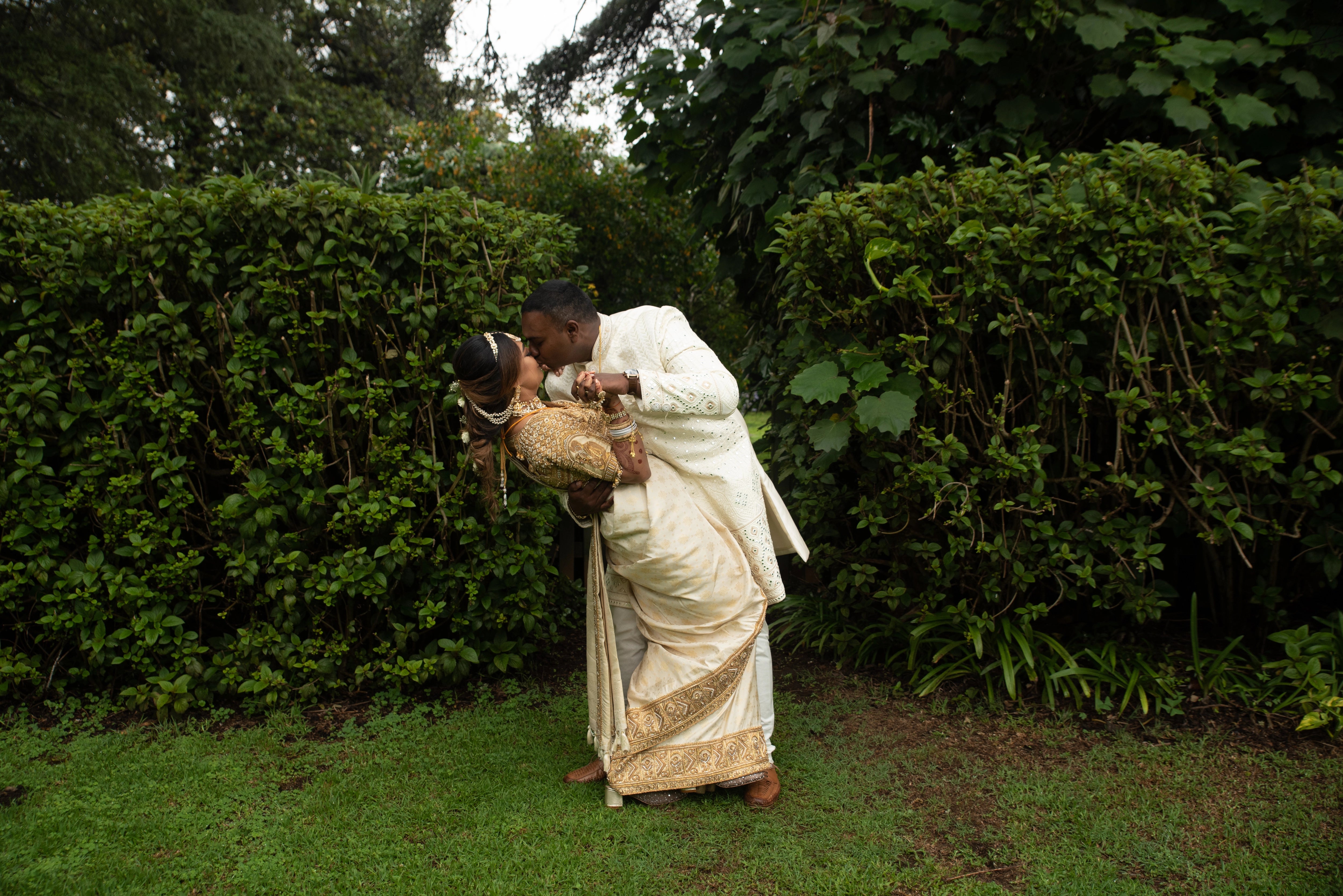 Bride Shayal in an embrace with groom in an ivory silk concept blouse & saree border, intricately handcrafted with zardozi, stones, pearls and coins by team Archana Karthick.