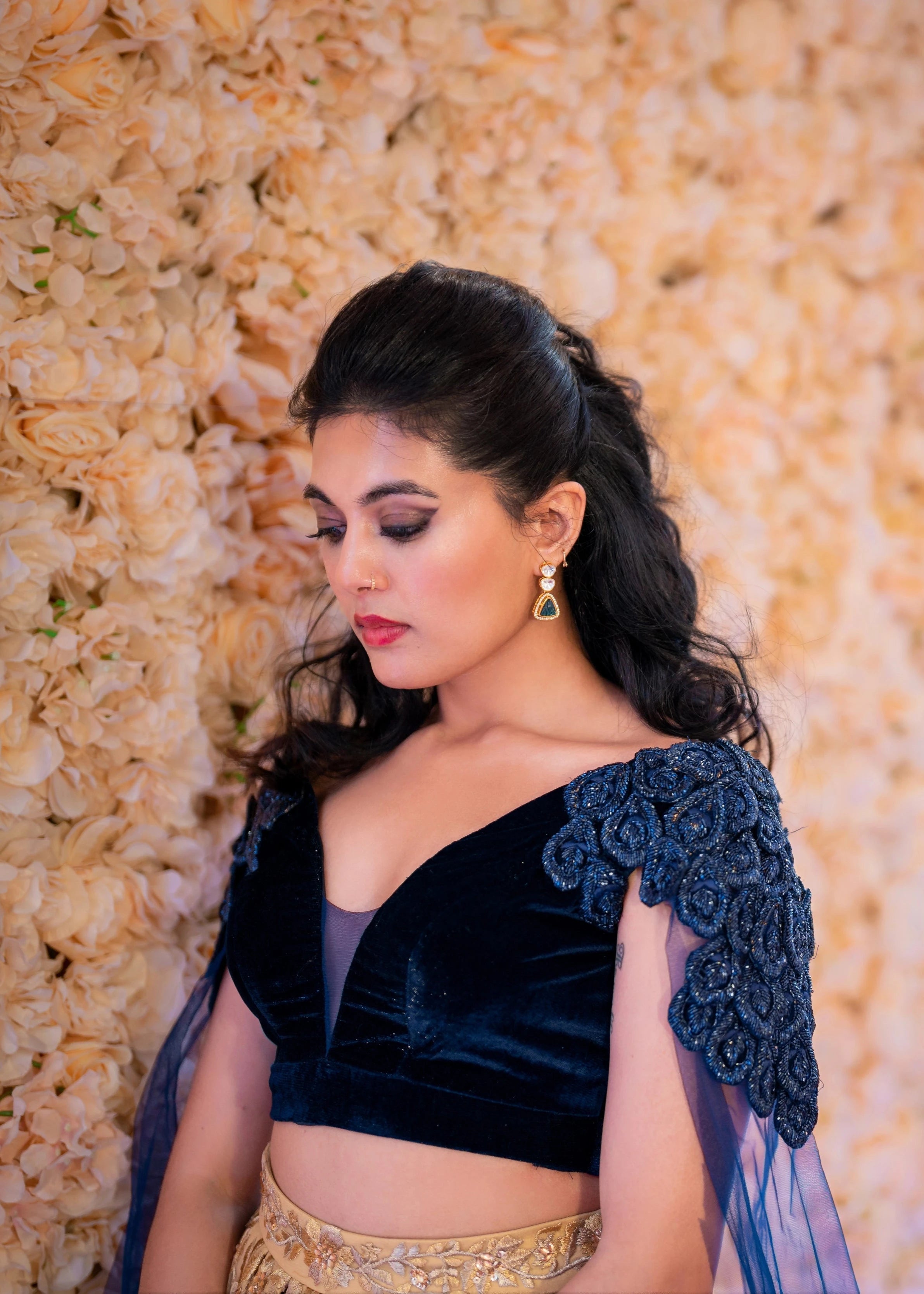 Bride Sneha Murugan for photoshoot in a midnight blue (velvet) and gold (tulle) lehenga, intricately handcrafted with zari, sequins, cutdana and stones by team Archana Karthick.