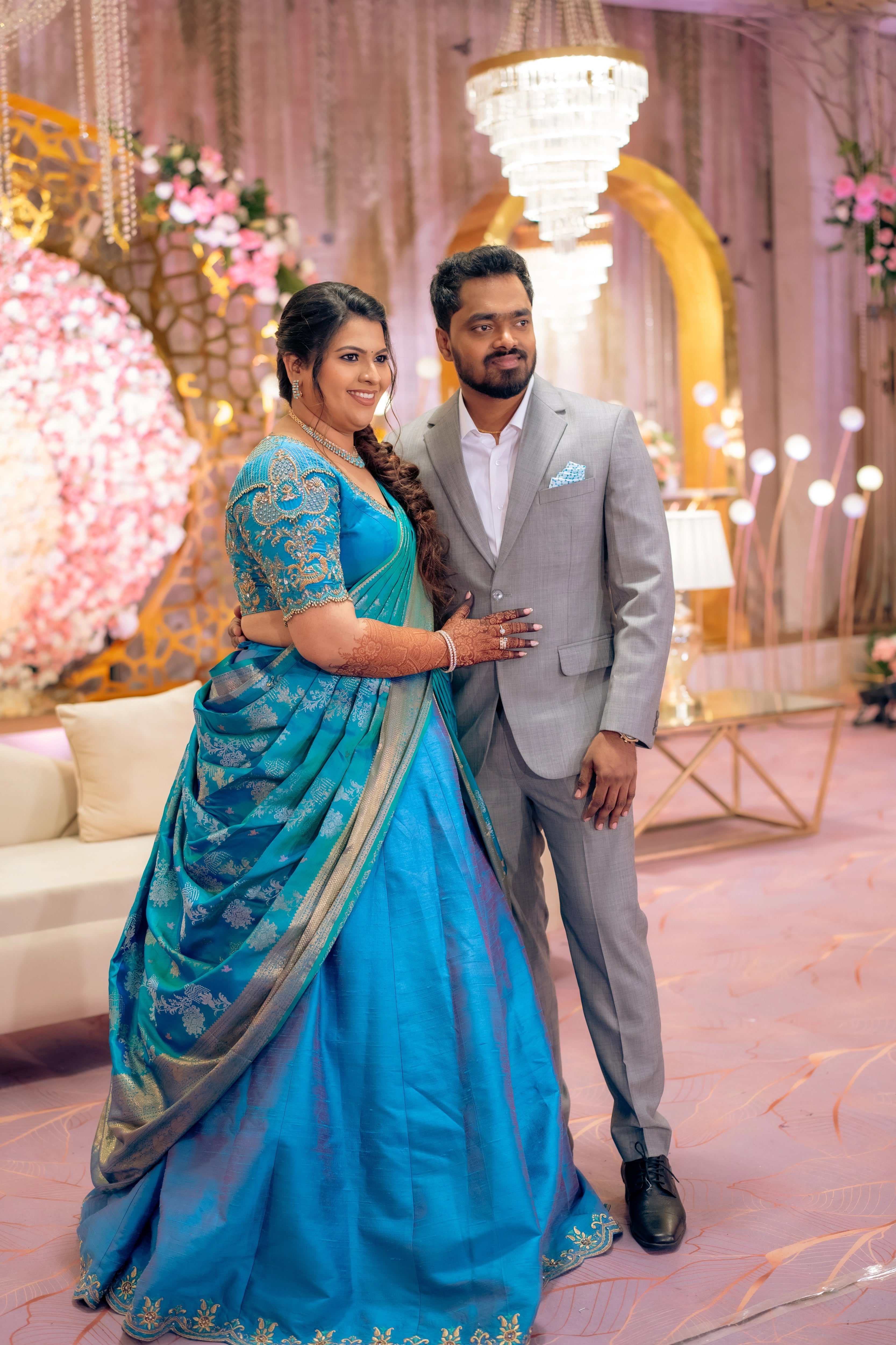 Bride Surrekha in a blue silk half saree by Archana Karthick