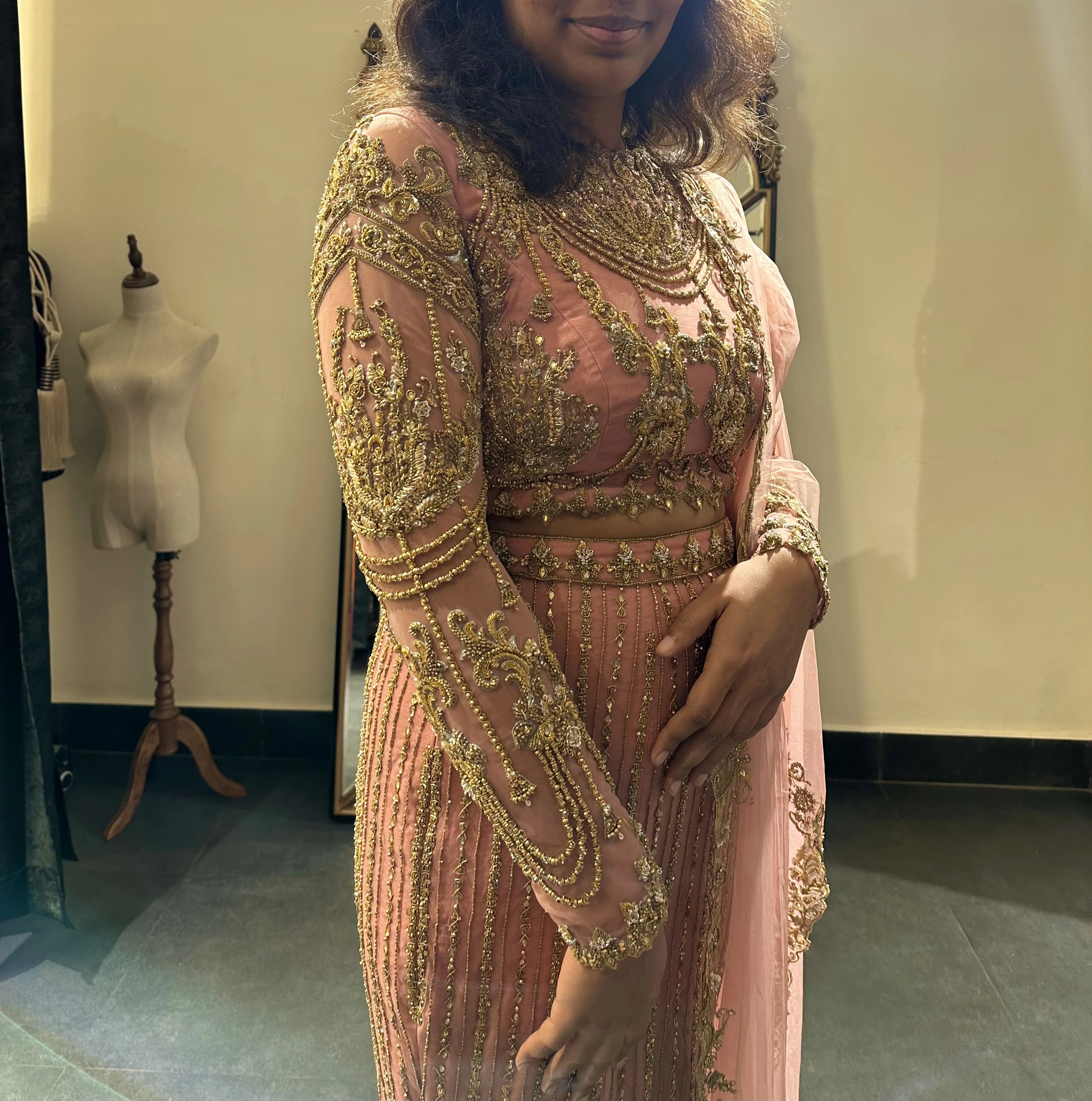 Bride Sushimita from US during her fittings in an onion pink tulle lehenga by team Archana Karthick.