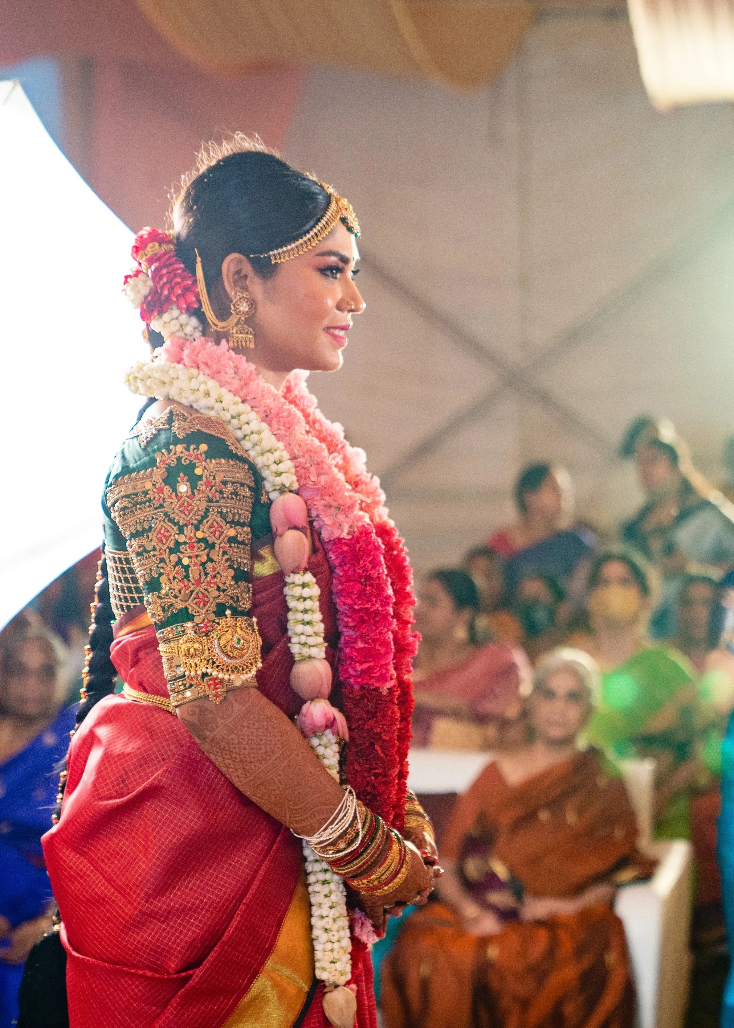Bride Vidya D in a bottle green silk blouse, handcrafted with beads, zardozi, kundan, resham, stones and coins by team Archana Karthick.