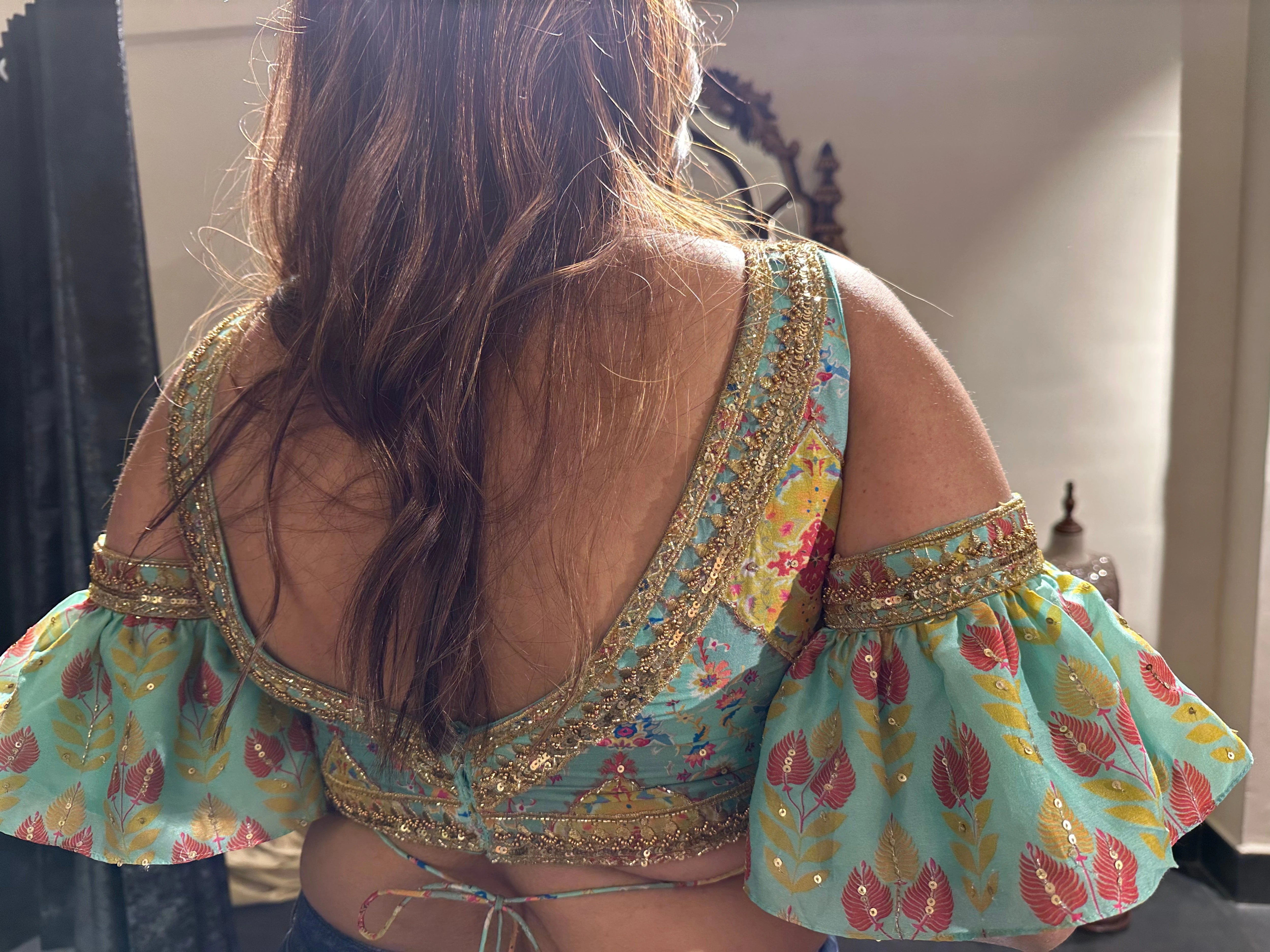 Bride Visali from USA, during her fittings in a blue chanderi silk cold shoulder blouse handcrafted by team Archana Karthick.