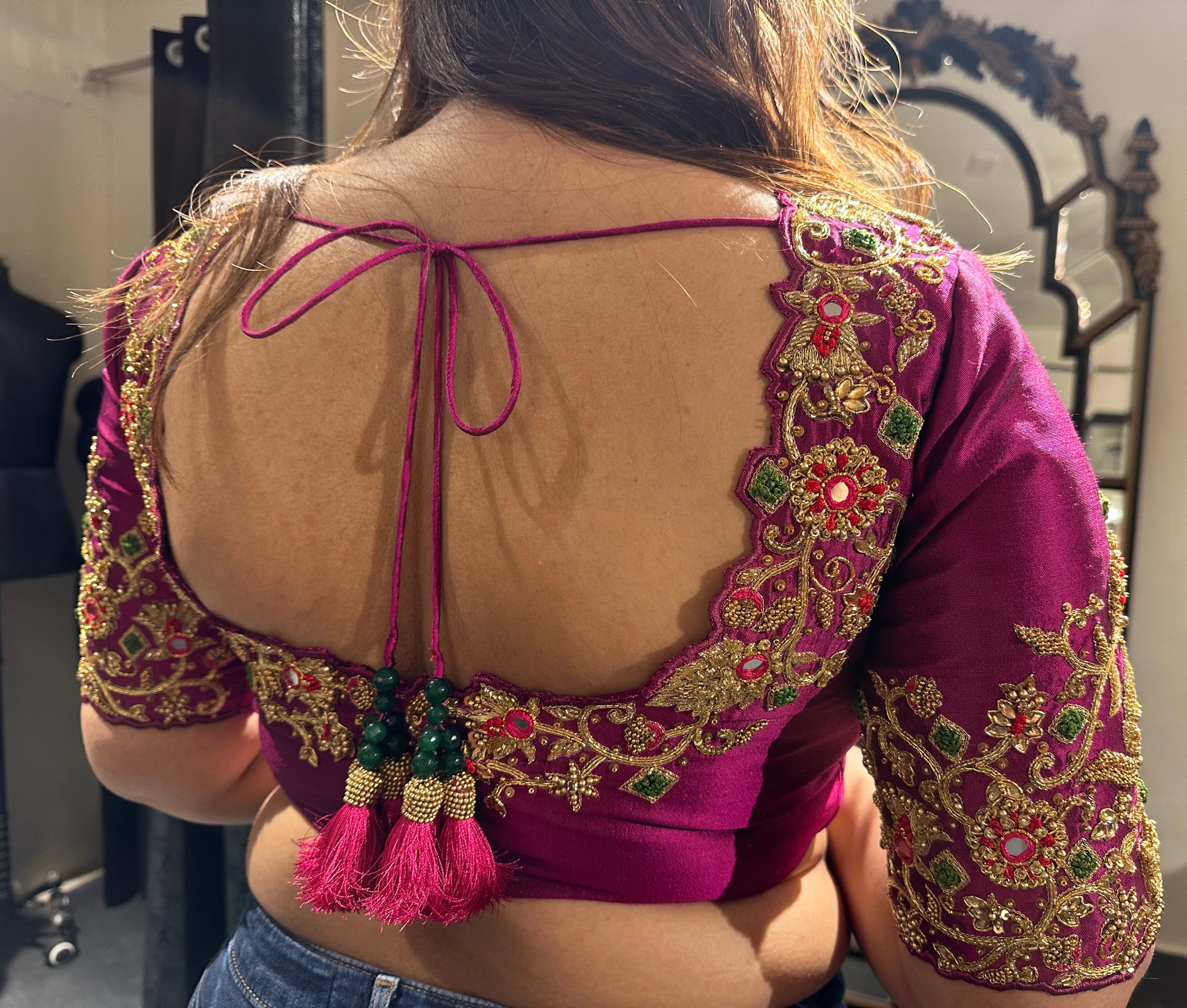 Bride Visali from USA during her fittings in a magenta raw silk blouse handcrafted by team Archana Karthick.
