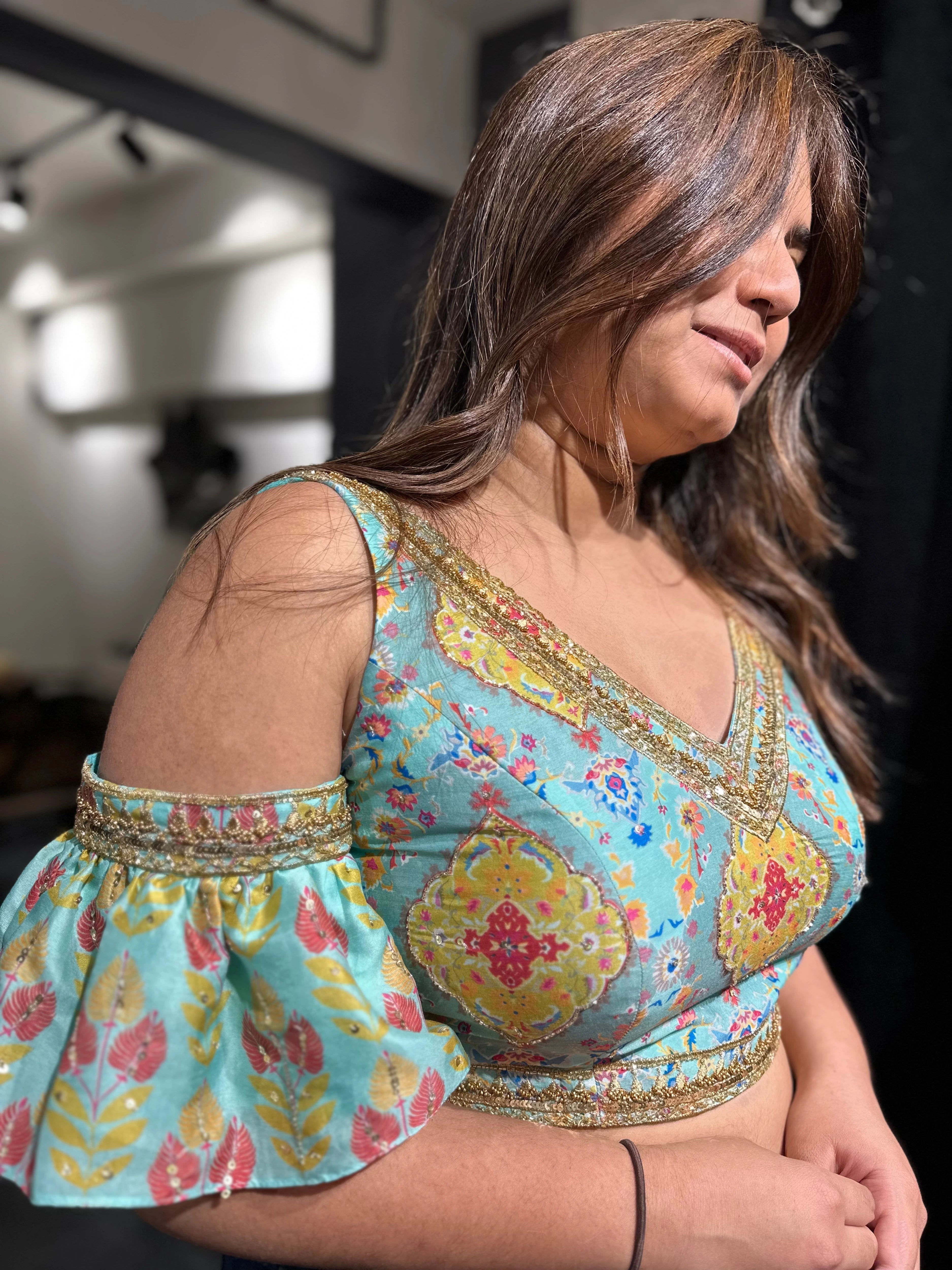 Bride Visali from USA in a blue chanderi silk cold shoulder blouse handcrafted by team Archana Karthick.