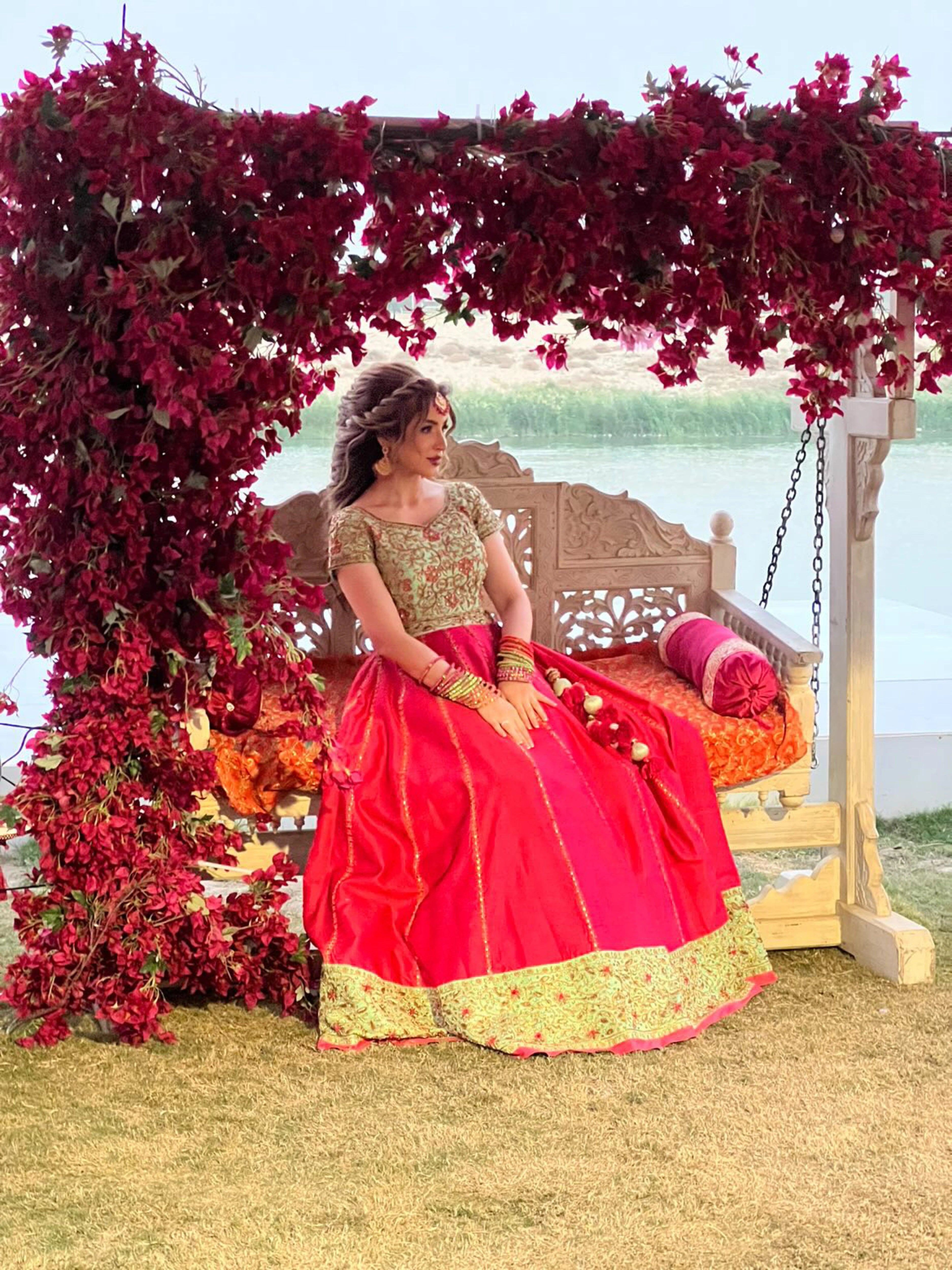 Bride from Baghdad, Iraq in a hot pink and mint green raw silk lehenga, handcrafted by team Archana Karthick.