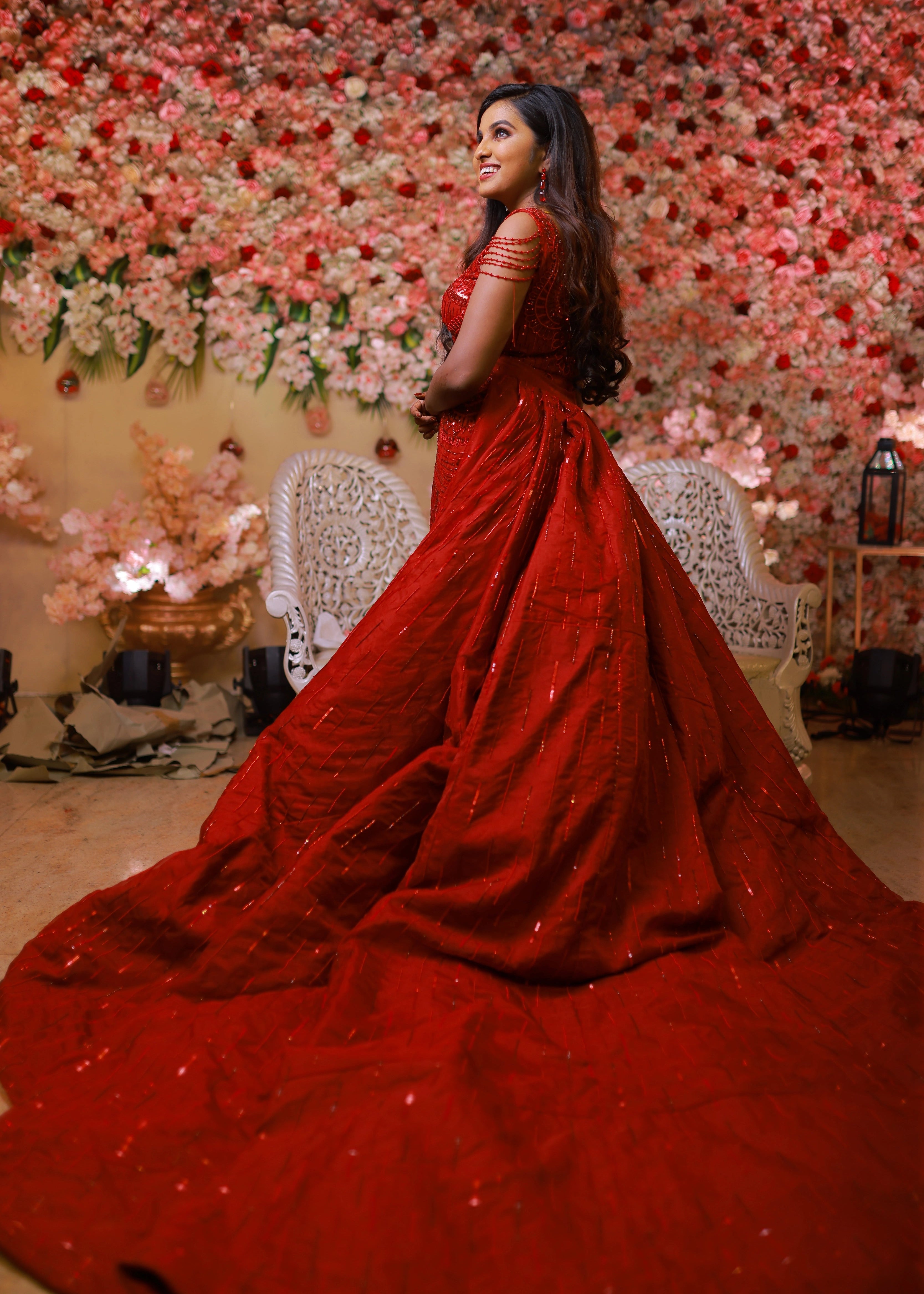 Bride from Chennai in a red mermaid gown with detachable trail handcrafted with rhinestones, crystal beads, cutdanas and sequins. Designed by Archana Karthick