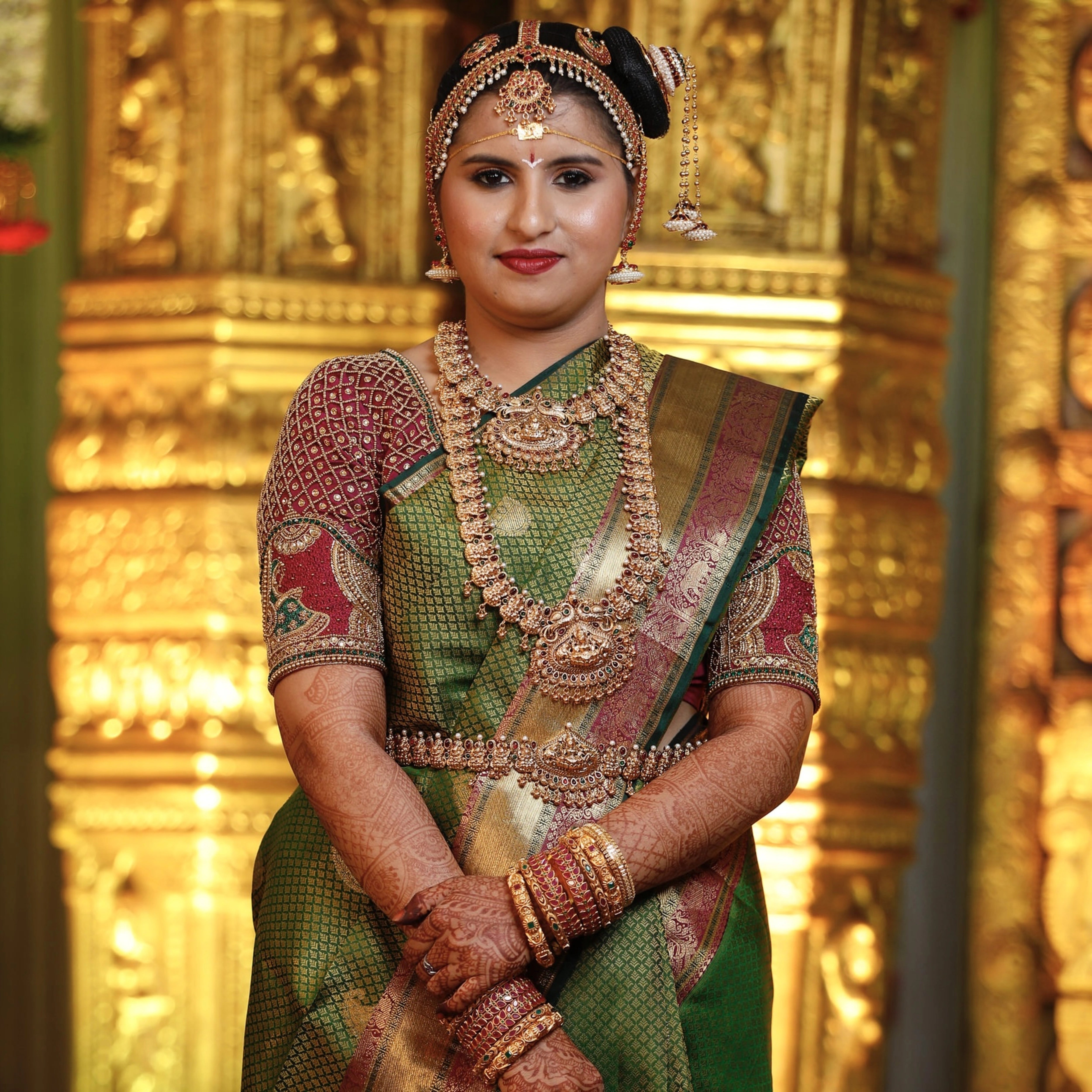 Bride from Chennai posing in a silk blouse designed by Archana Karthick handcrafted intricately with zardozi, beads, resham and kundan.