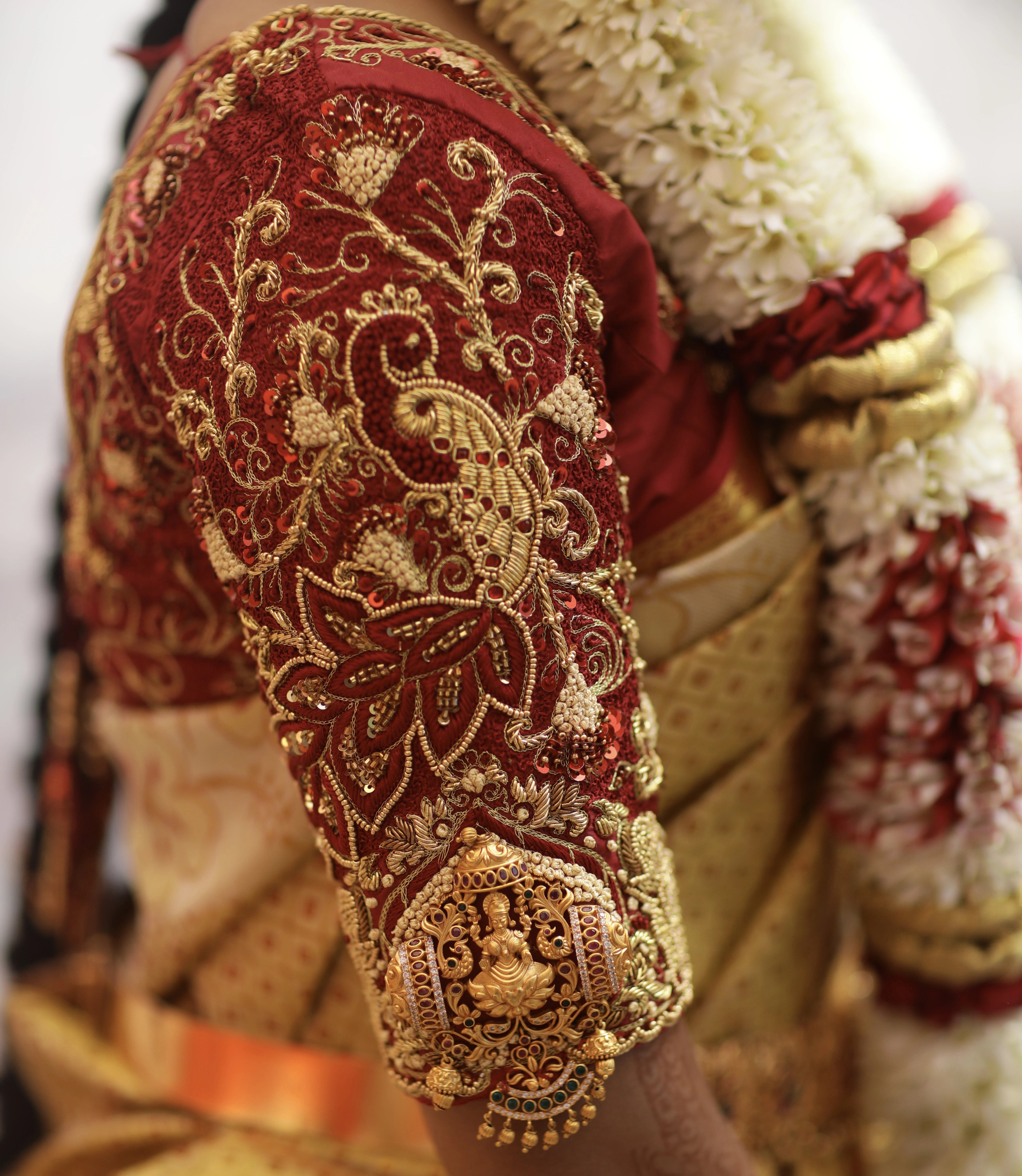 Bride from Coimbatore in a concept maroon silk blouse designed by Archana Karthick handcrafted intricately with zardozi, beads, resham knots and kundan.