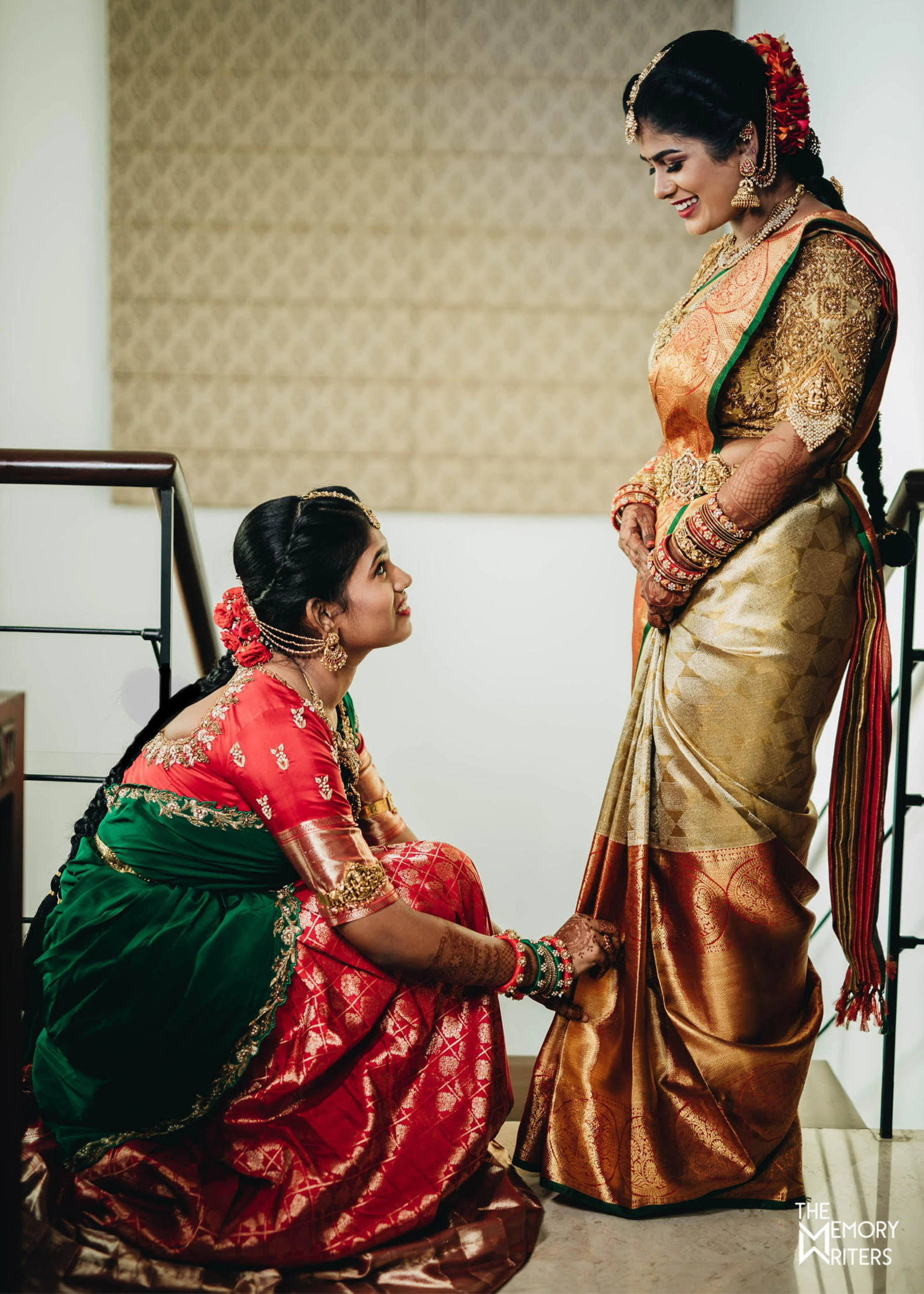 Bride from Erode in a handcrafted gold silk blouse designed by Archana Karthick posing with her sister