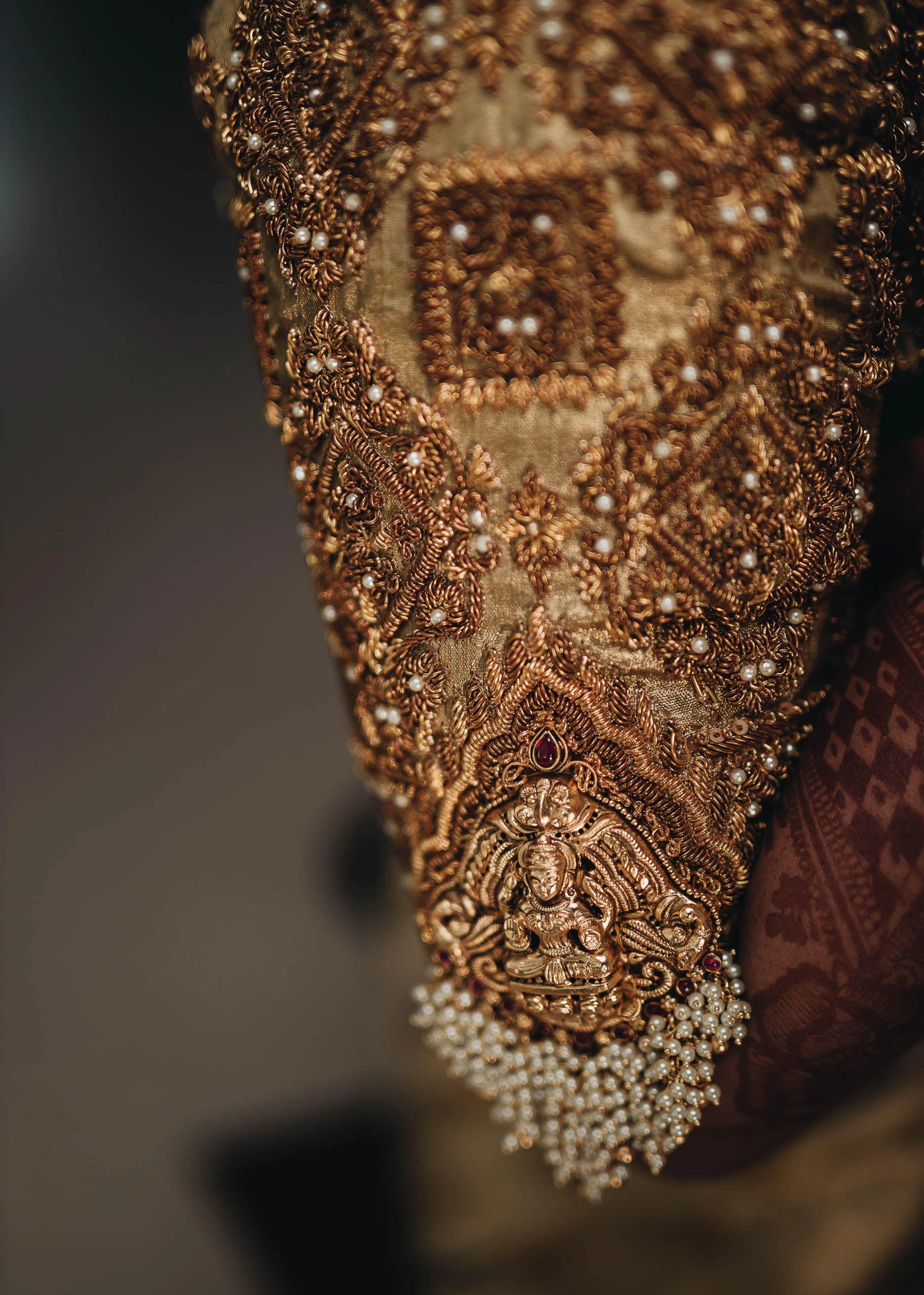 Bride from Erode in a handcrafted gold silk blouse designed by Archana Karthick showcasing her sleeve