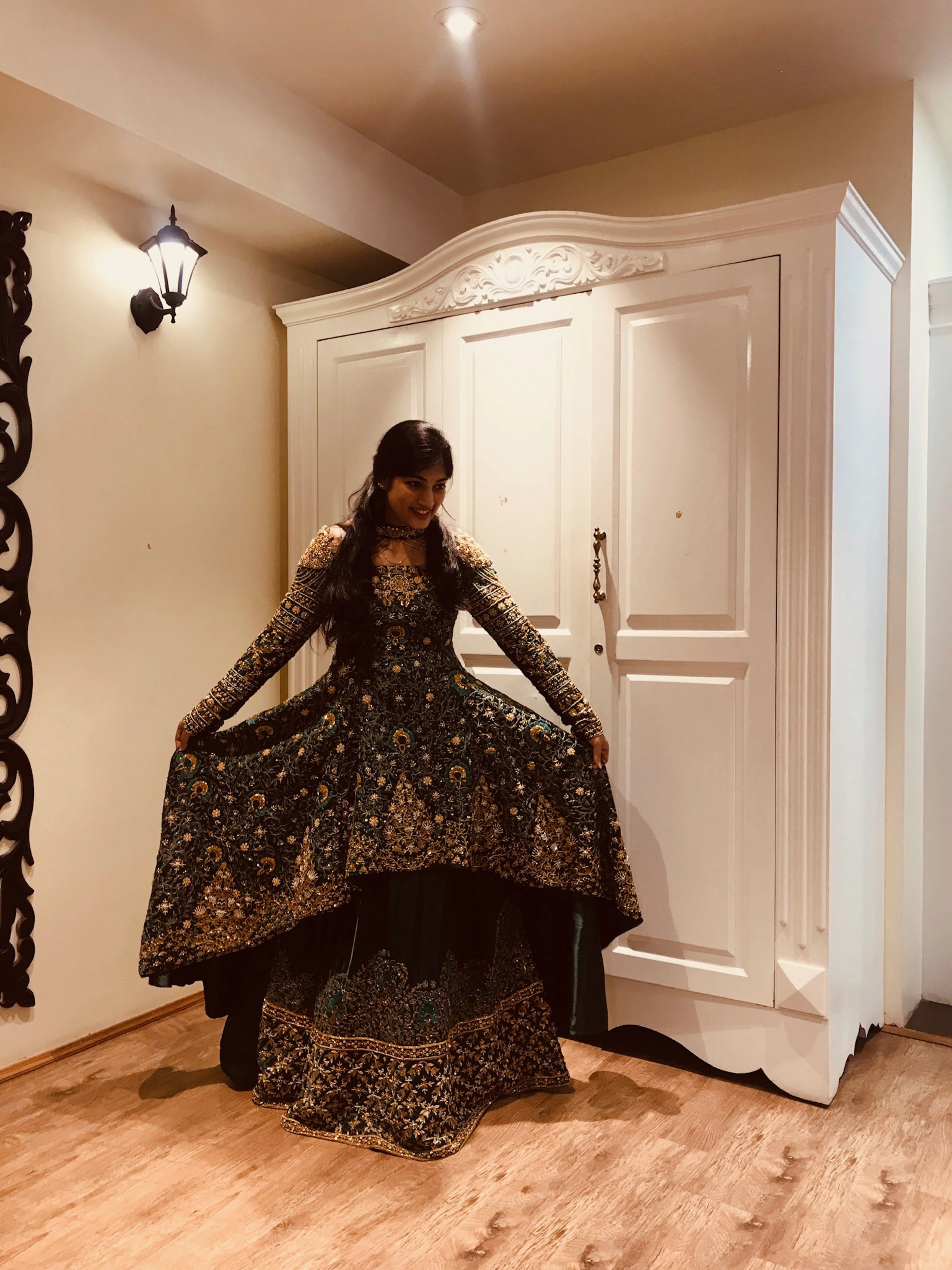 Bride from Kuwait during her fittings in a bottle green satin silk masakali lehenga handcrafted with zardozi, rhinestones, crystals and more. Designed by Archana Karthick.