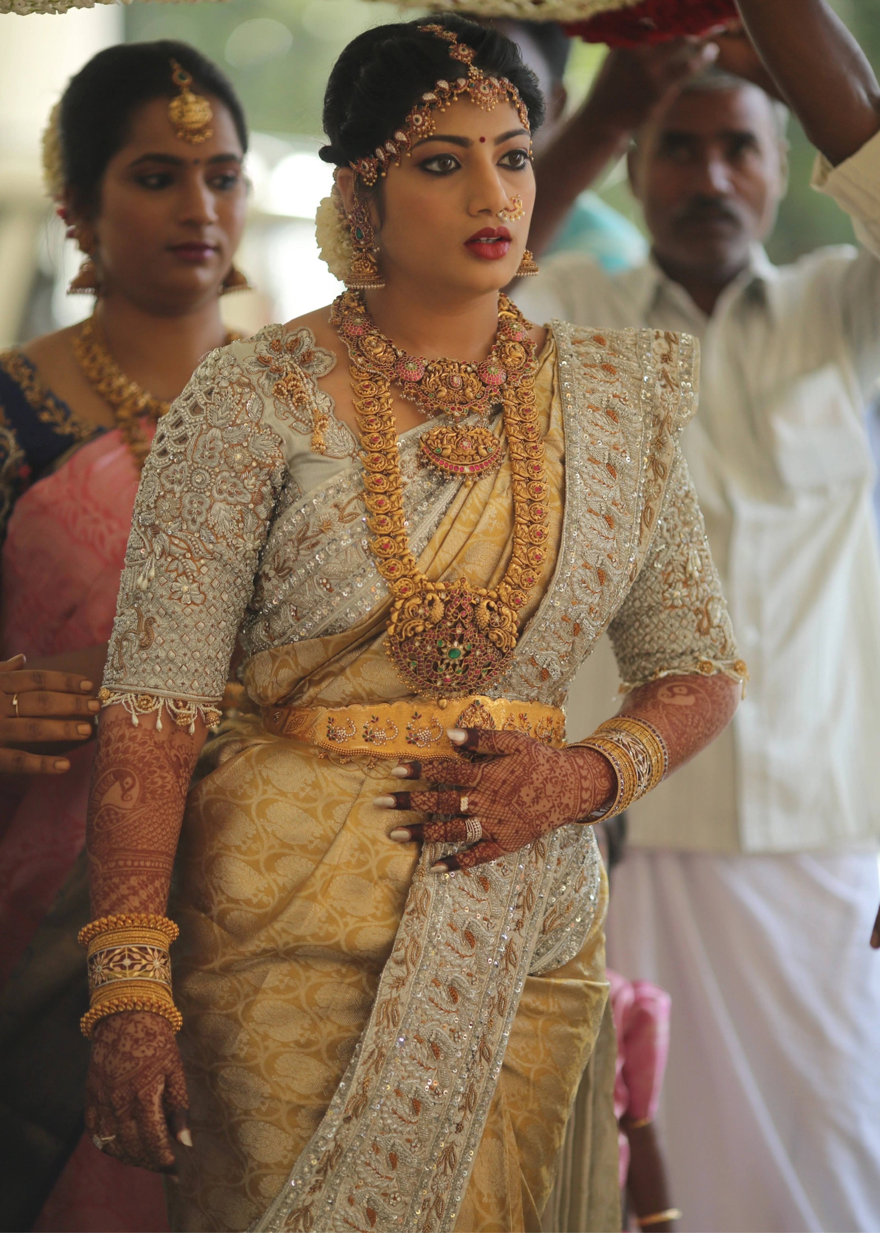 Bride from Kuwait walking in a silver silk blouse and saree border handcrafted with stones, crystals, zardozi, beads, rhinestones, cutdanas and sequins. Designed by Archana Karthick.