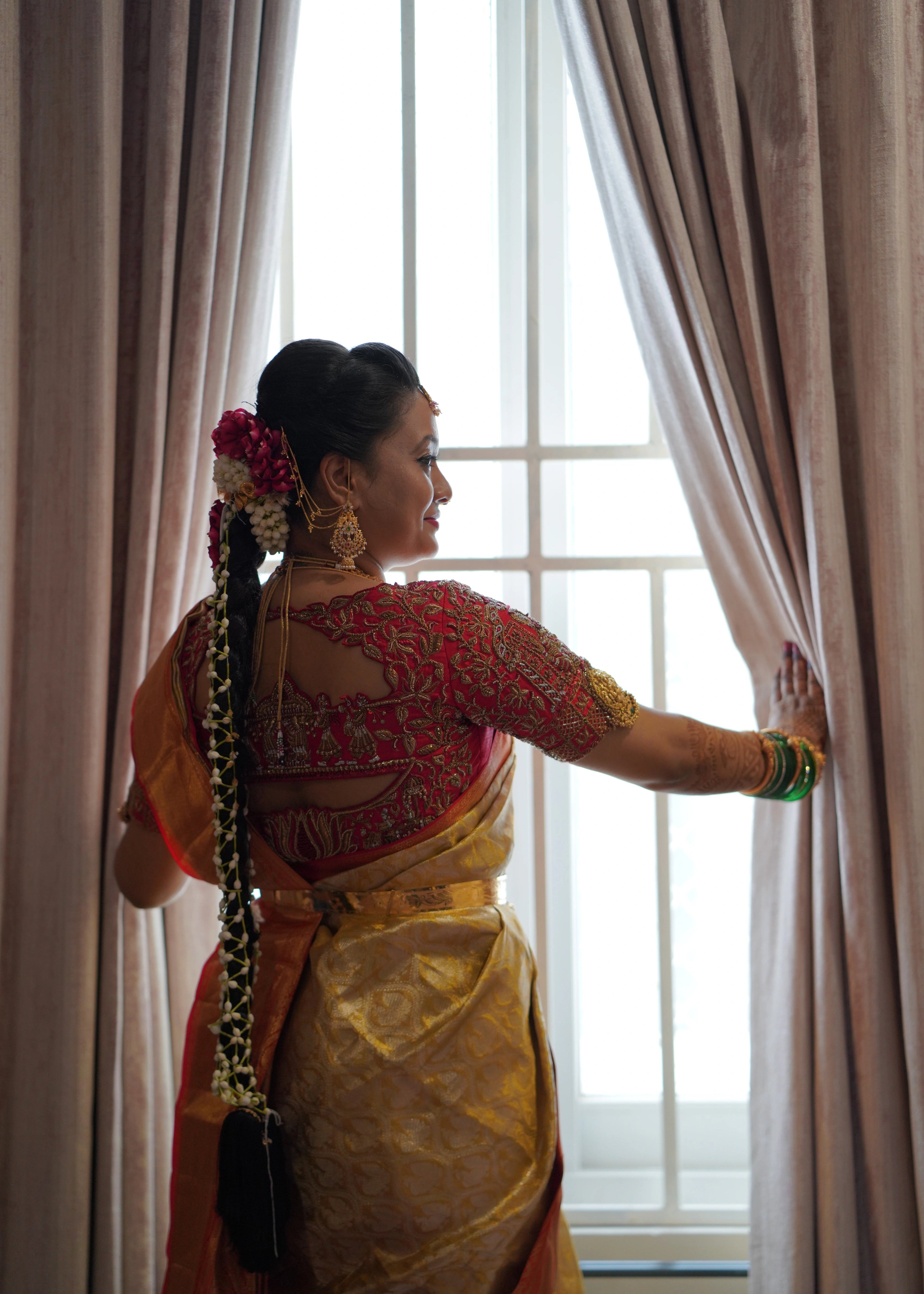 Bride from Seattle in a concept red raw silk blouse and tulle veil handcrafted intricately with zardozi, beads, stones and sequins. Designed by Archana Karthick