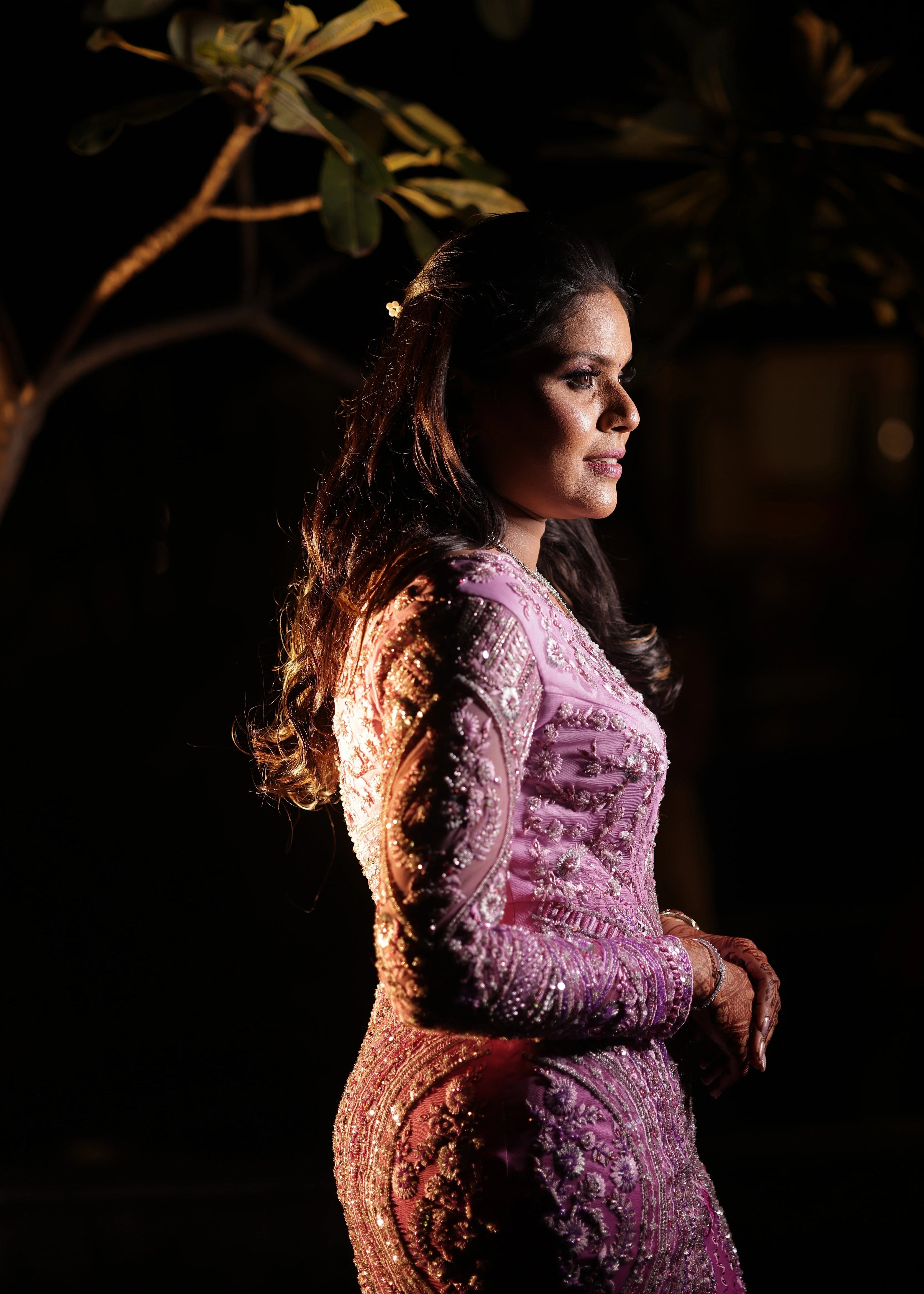 Bride from UK posing in ombre pink mermaid gown designed by Archana Karthick